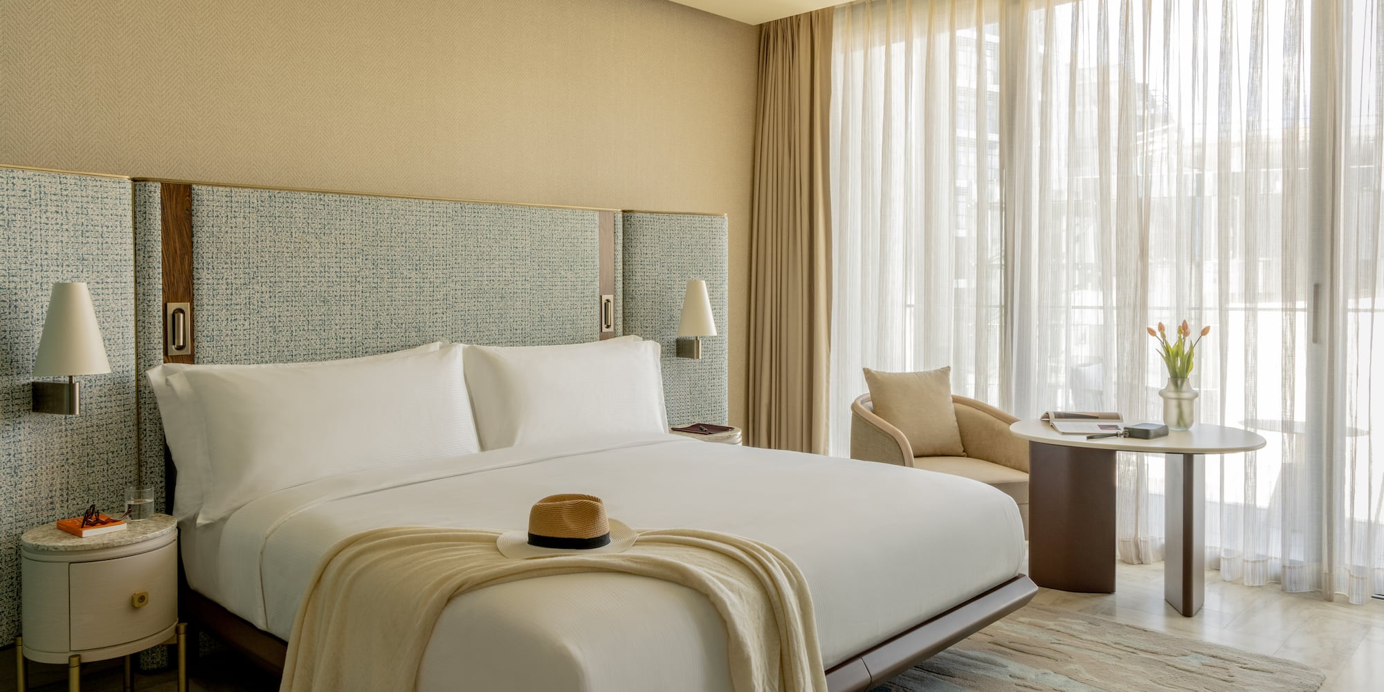 a bed with a hat on it