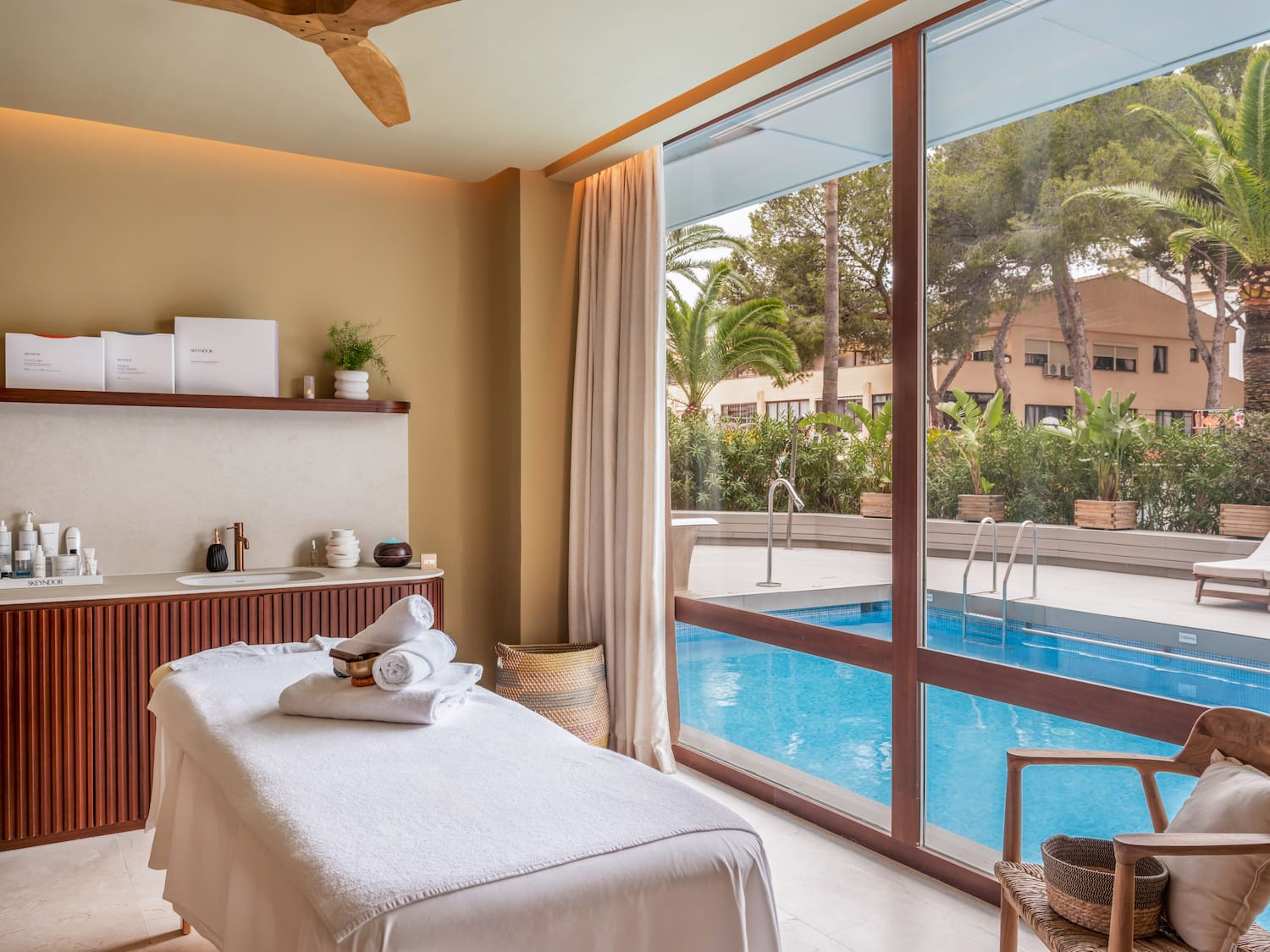 a massage table with a pool outside