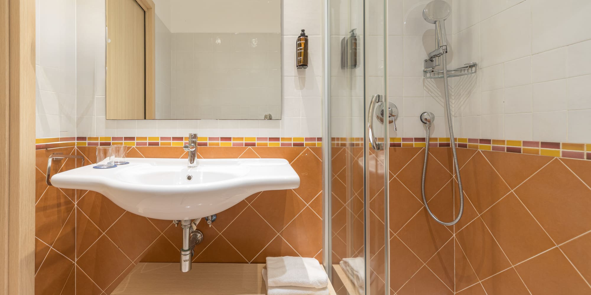 a bathroom with a shower and sink