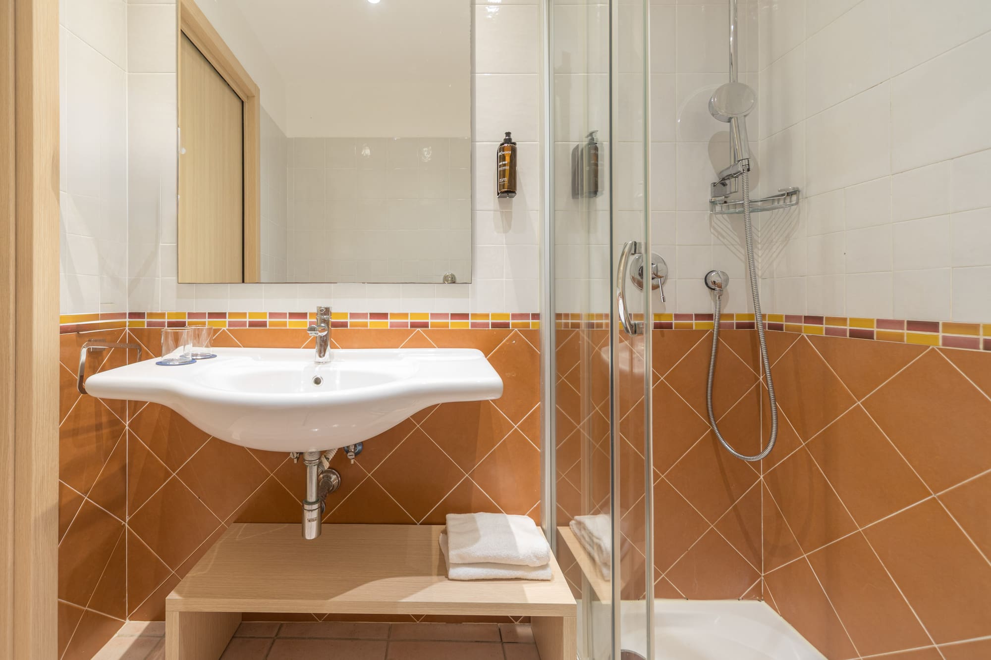 a bathroom with a shower and sink