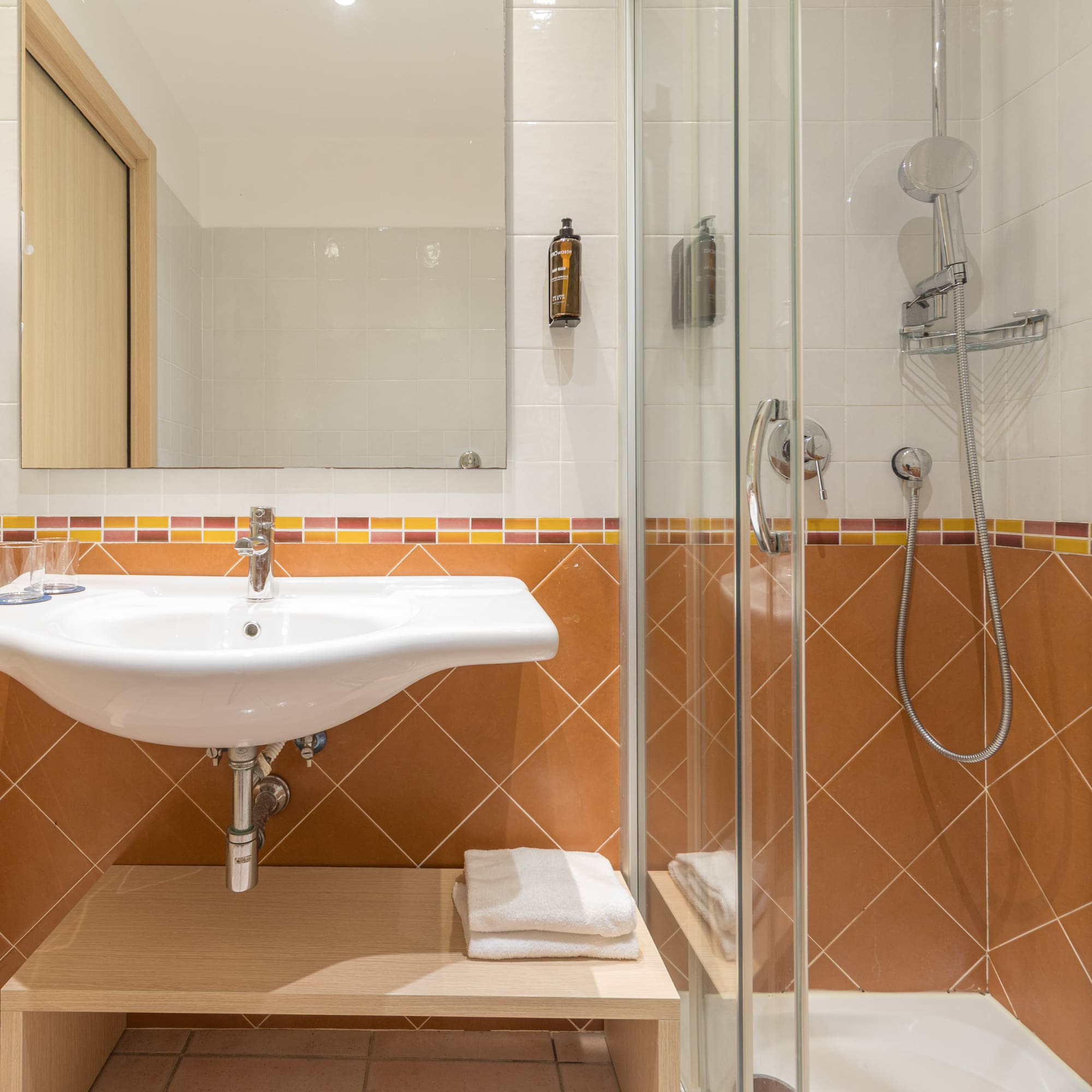 a bathroom with a shower and sink