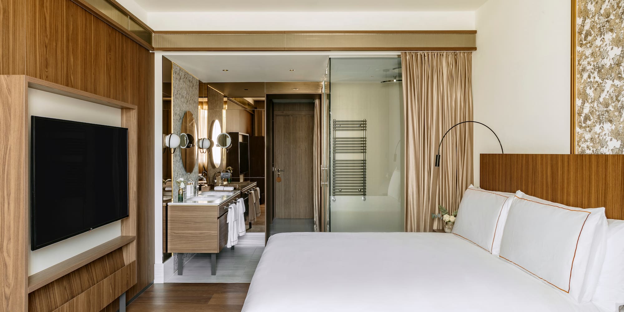 a bedroom with a television and a bed