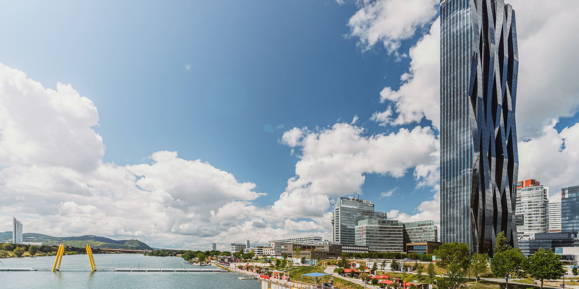 a tall building next to a body of water