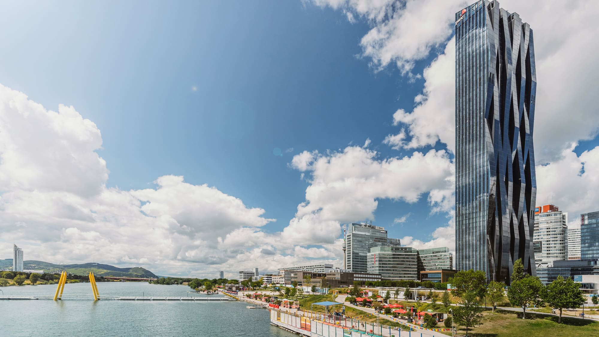 a tall building next to a body of water