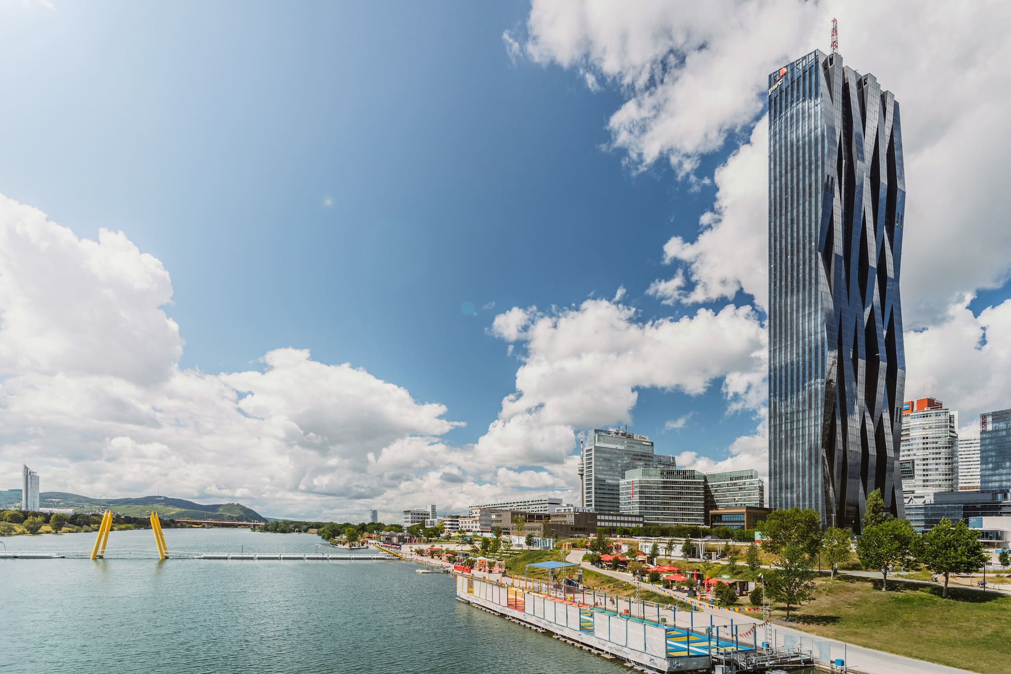 a tall building next to a body of water