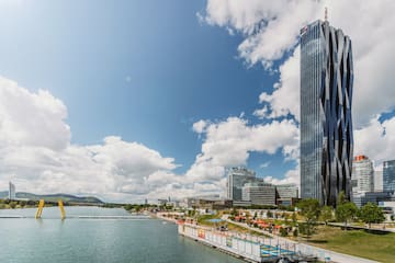 a tall building next to a body of water