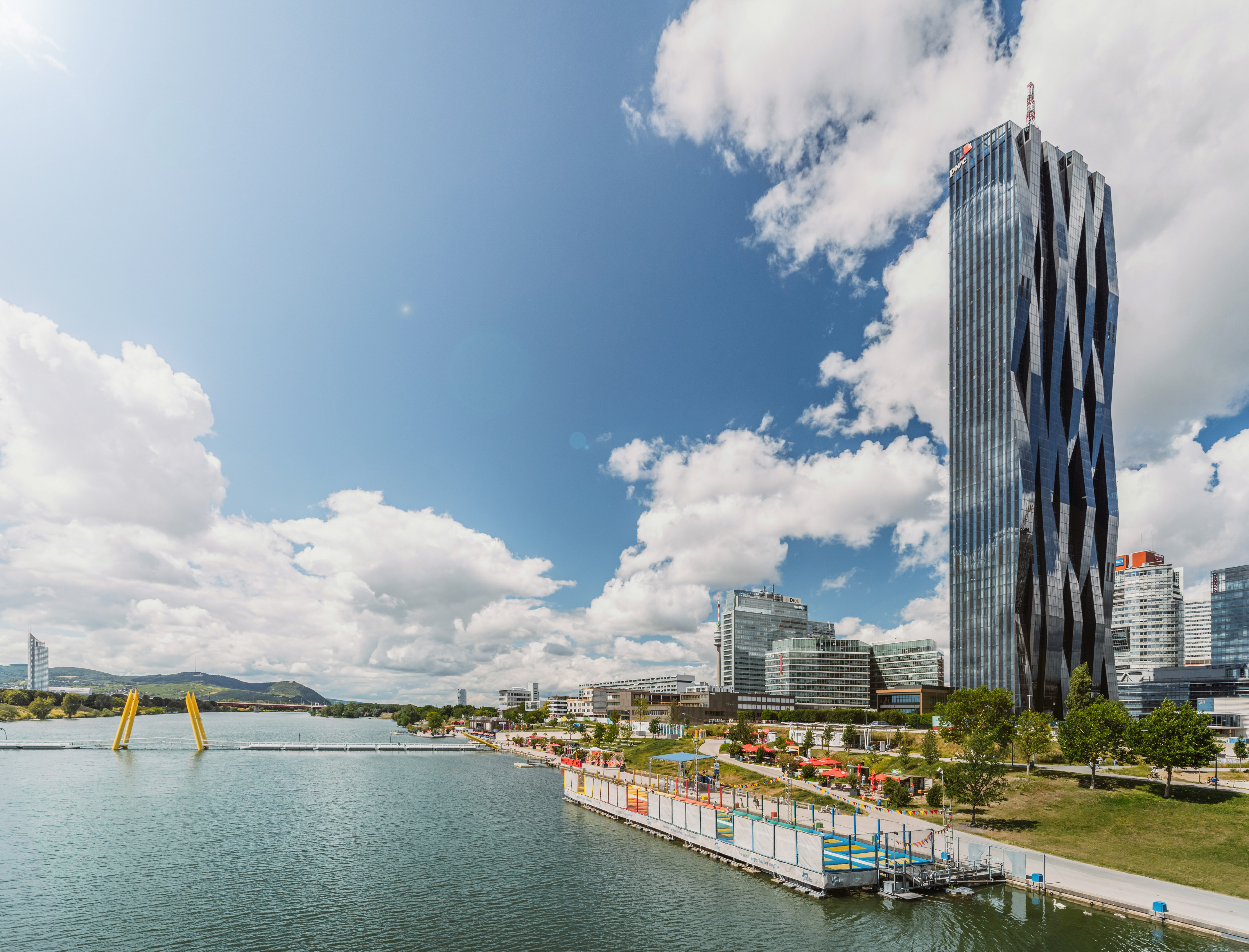 Vienna's Donau City skyline: DC Tower 1, Danube River, and modern waterfront.