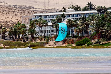 a person parasailing on a beach