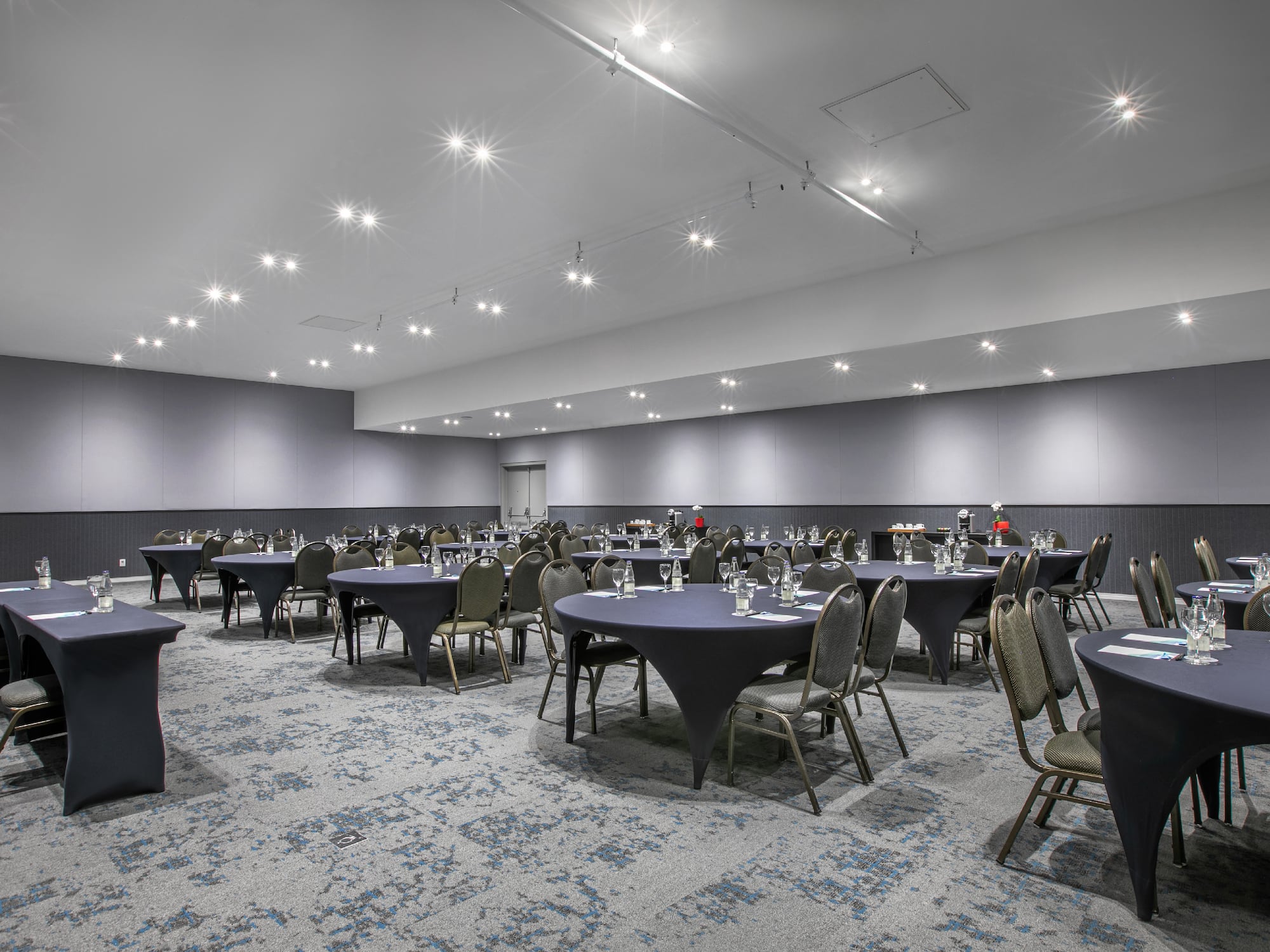 a room with tables and chairs