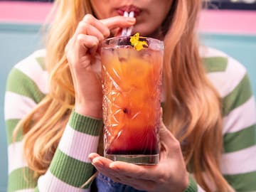 a woman drinking a drink