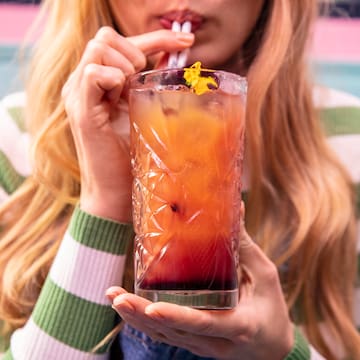 a woman drinking a drink