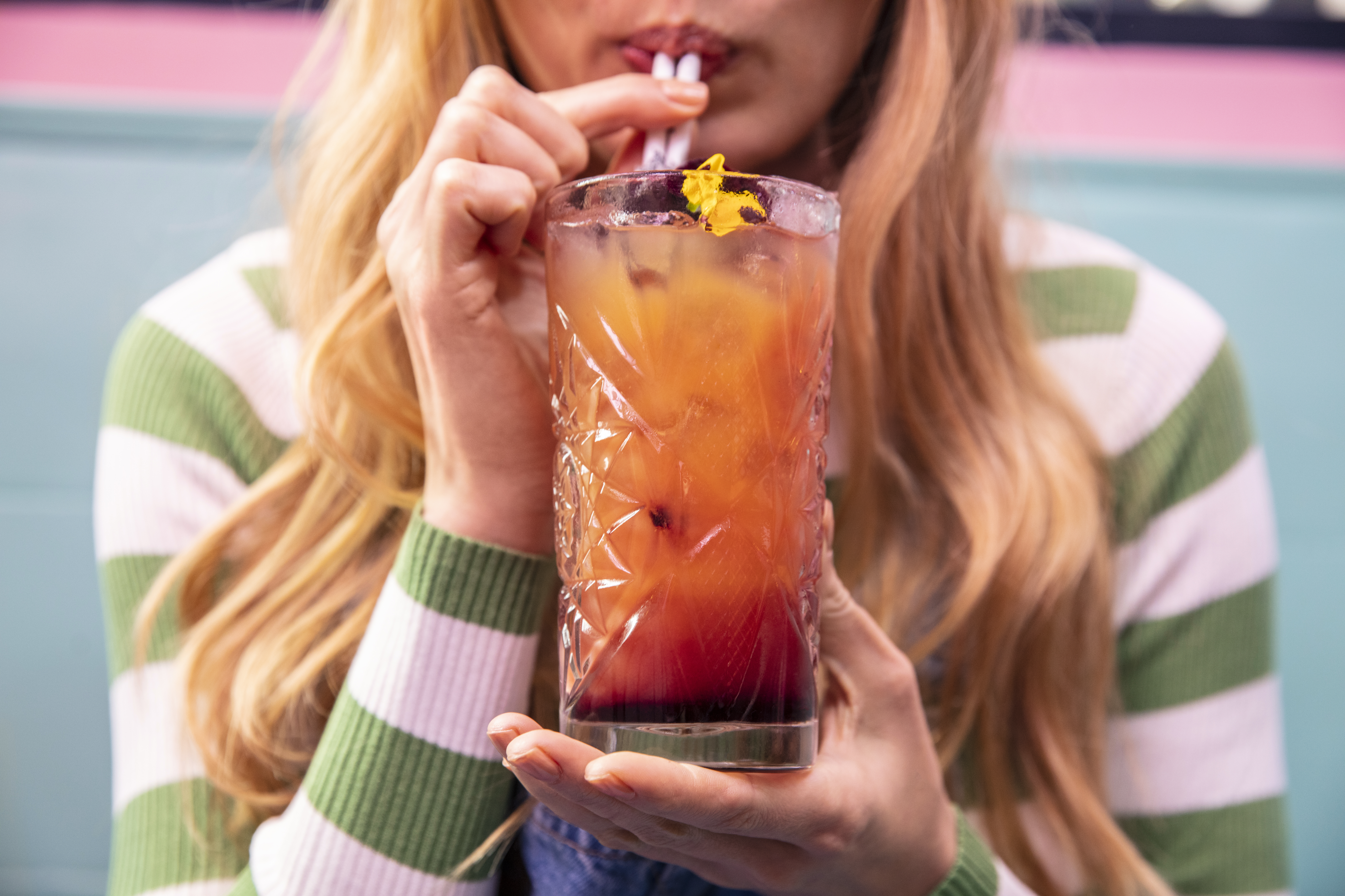 a woman drinking a drink