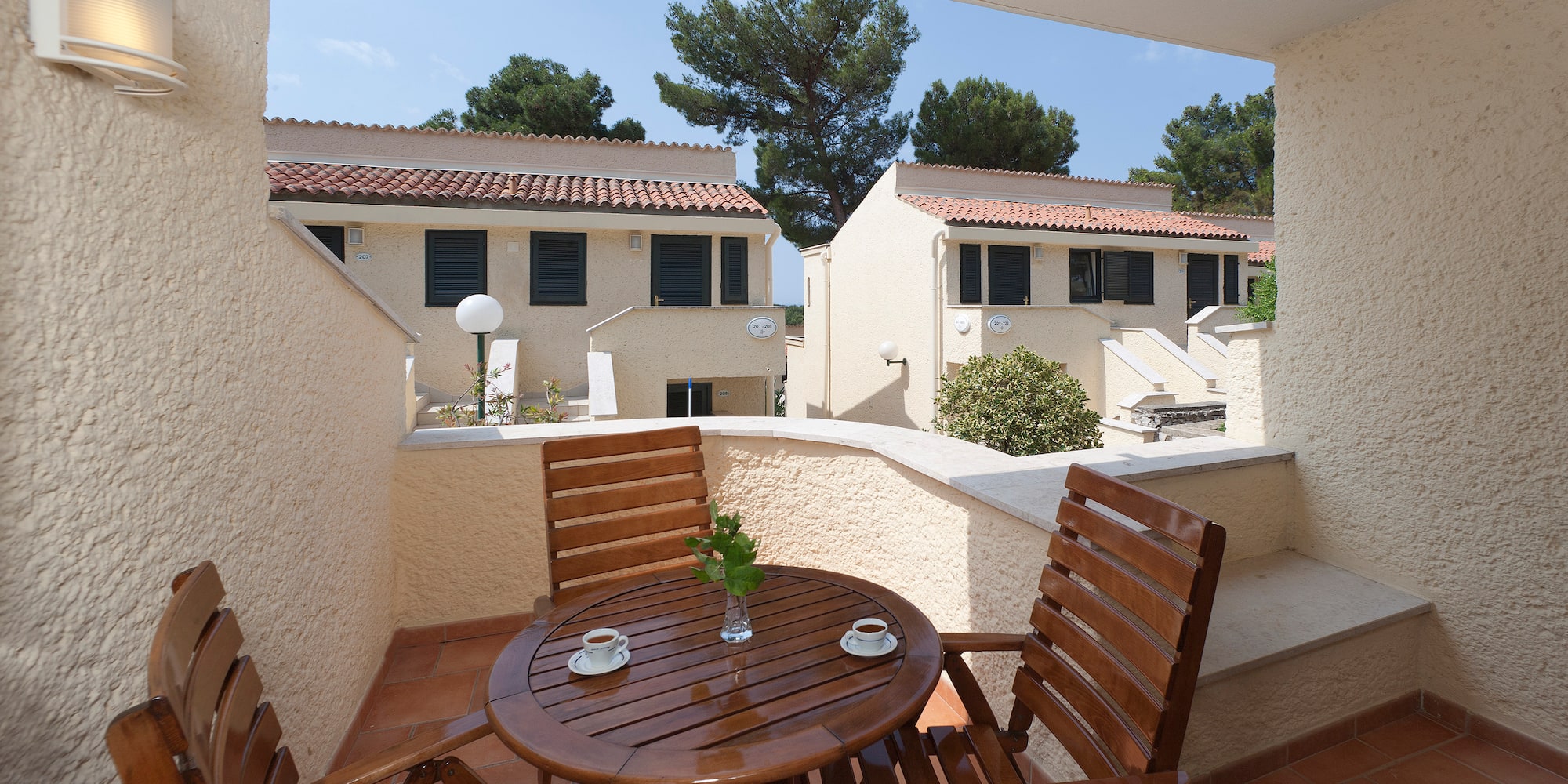 a table and chairs on a balcony