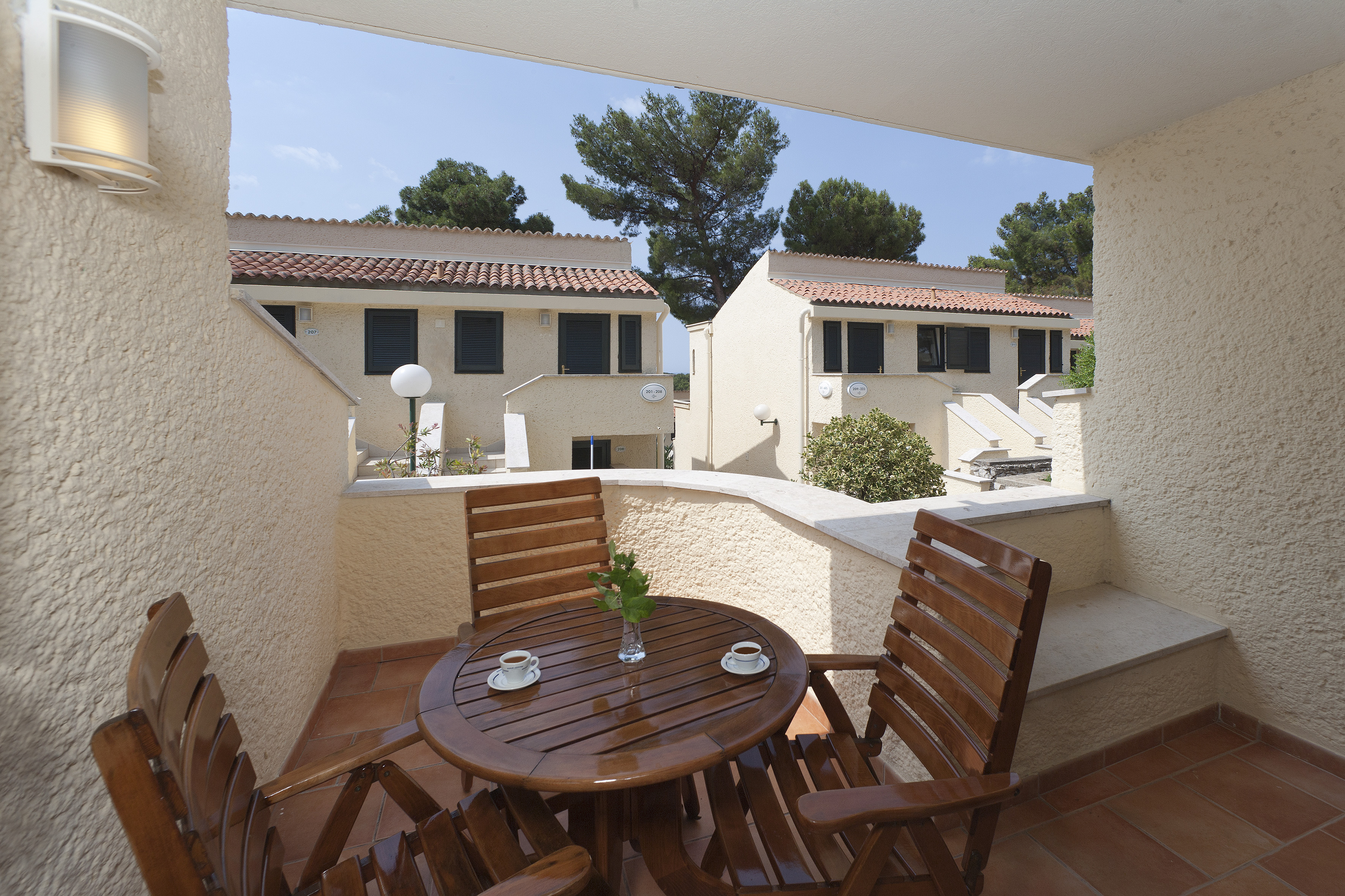 a table and chairs on a balcony