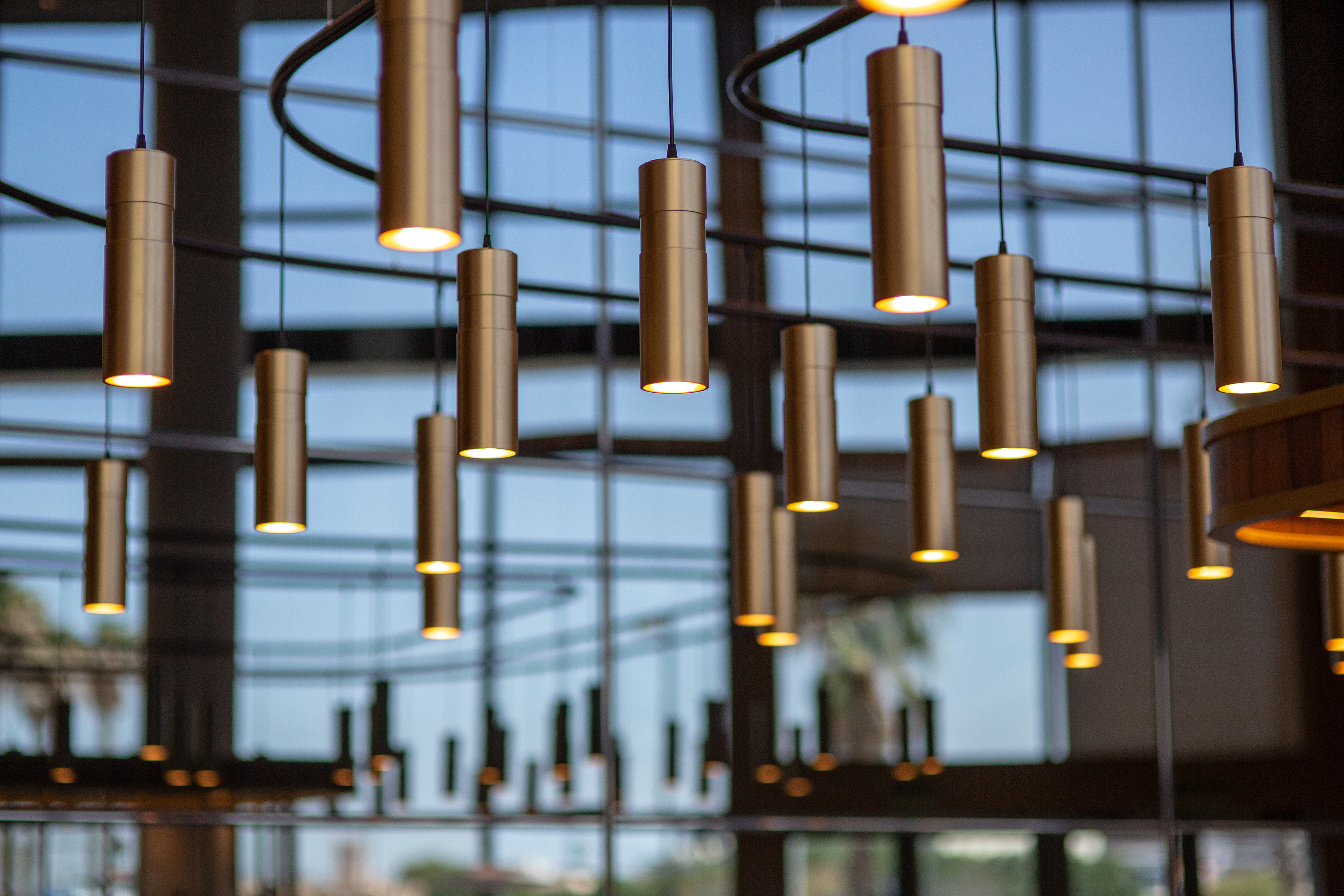 a group of gold colored lights from a ceiling