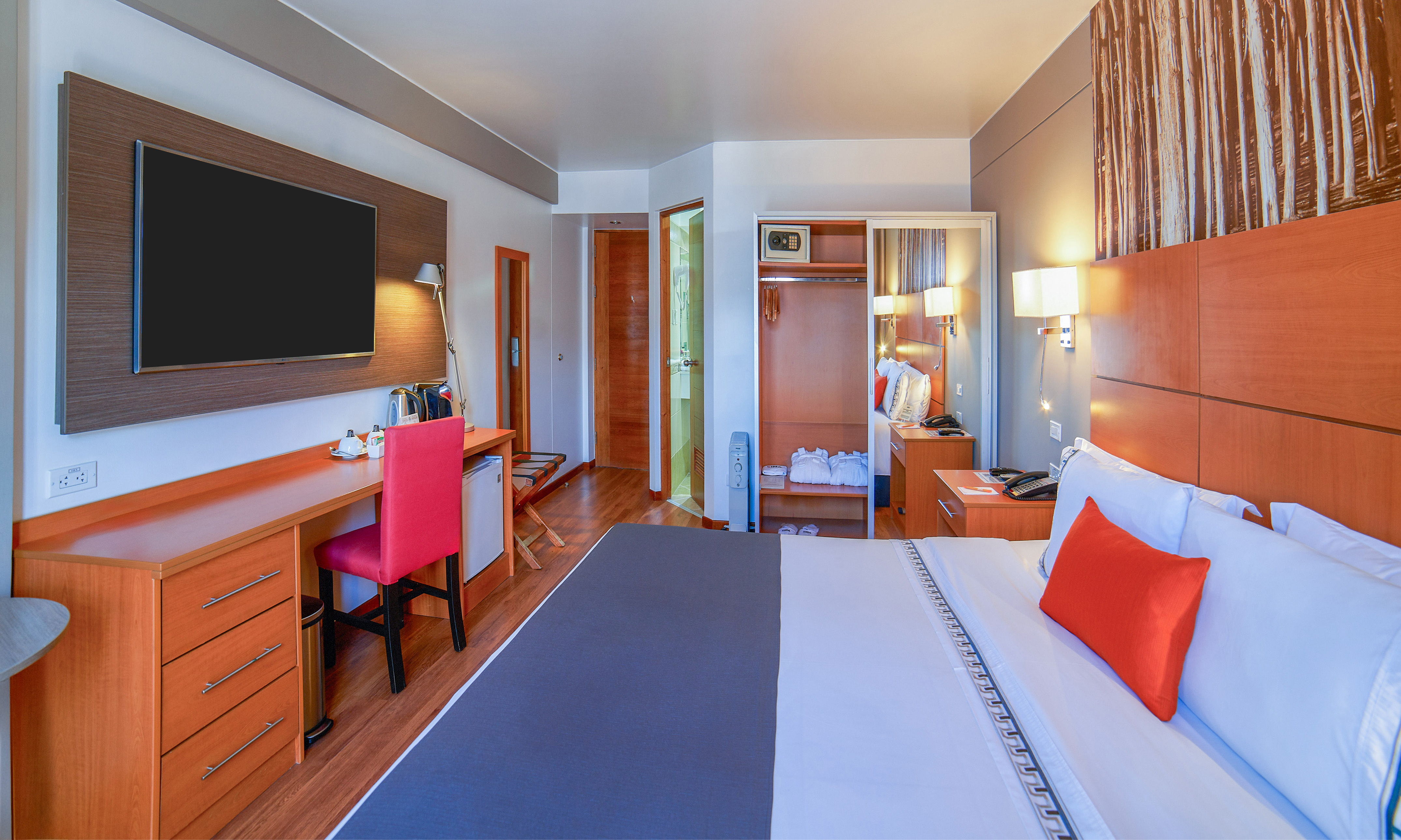 a room with a bed and a tv