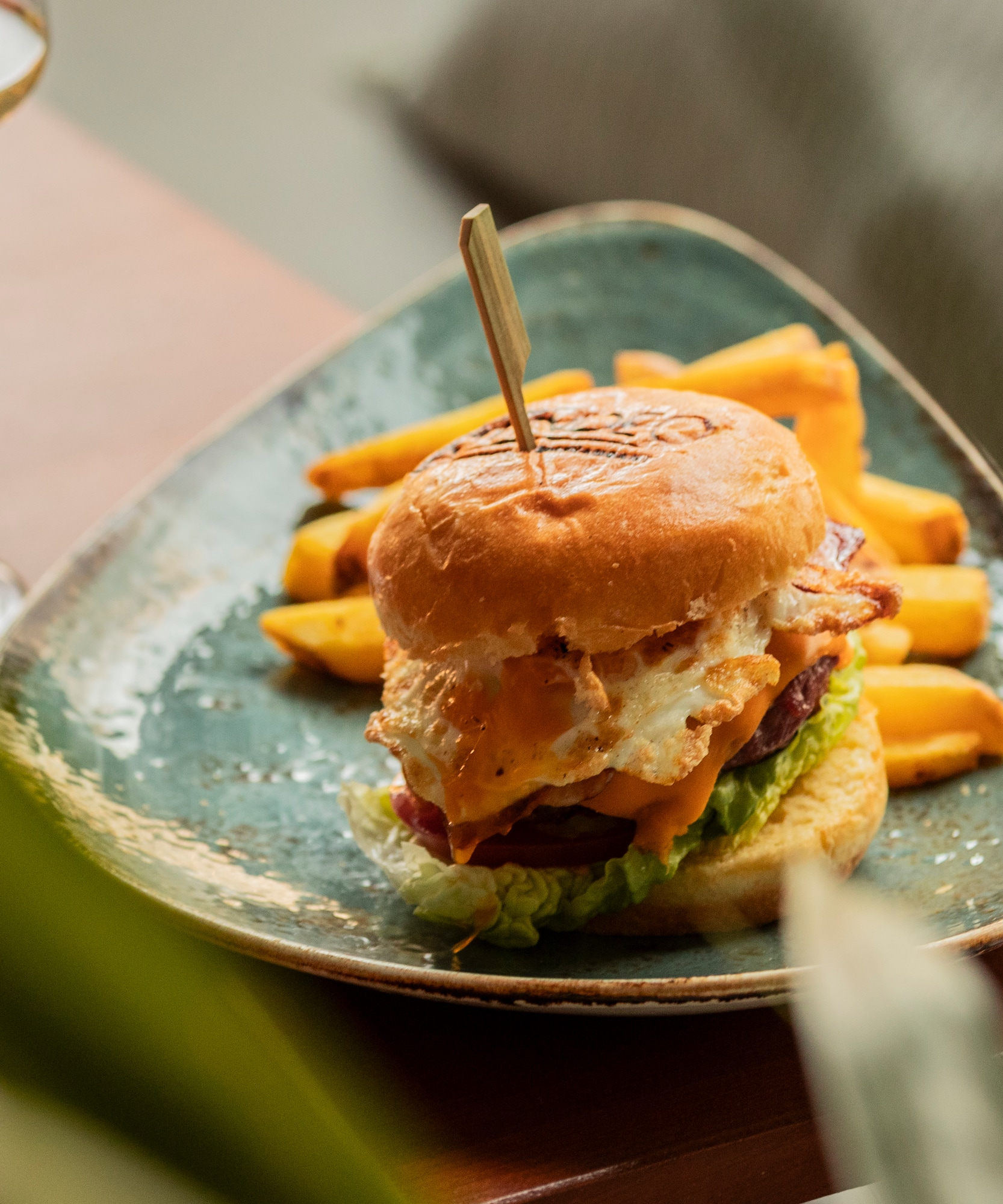 a plate of food with a burger and fries