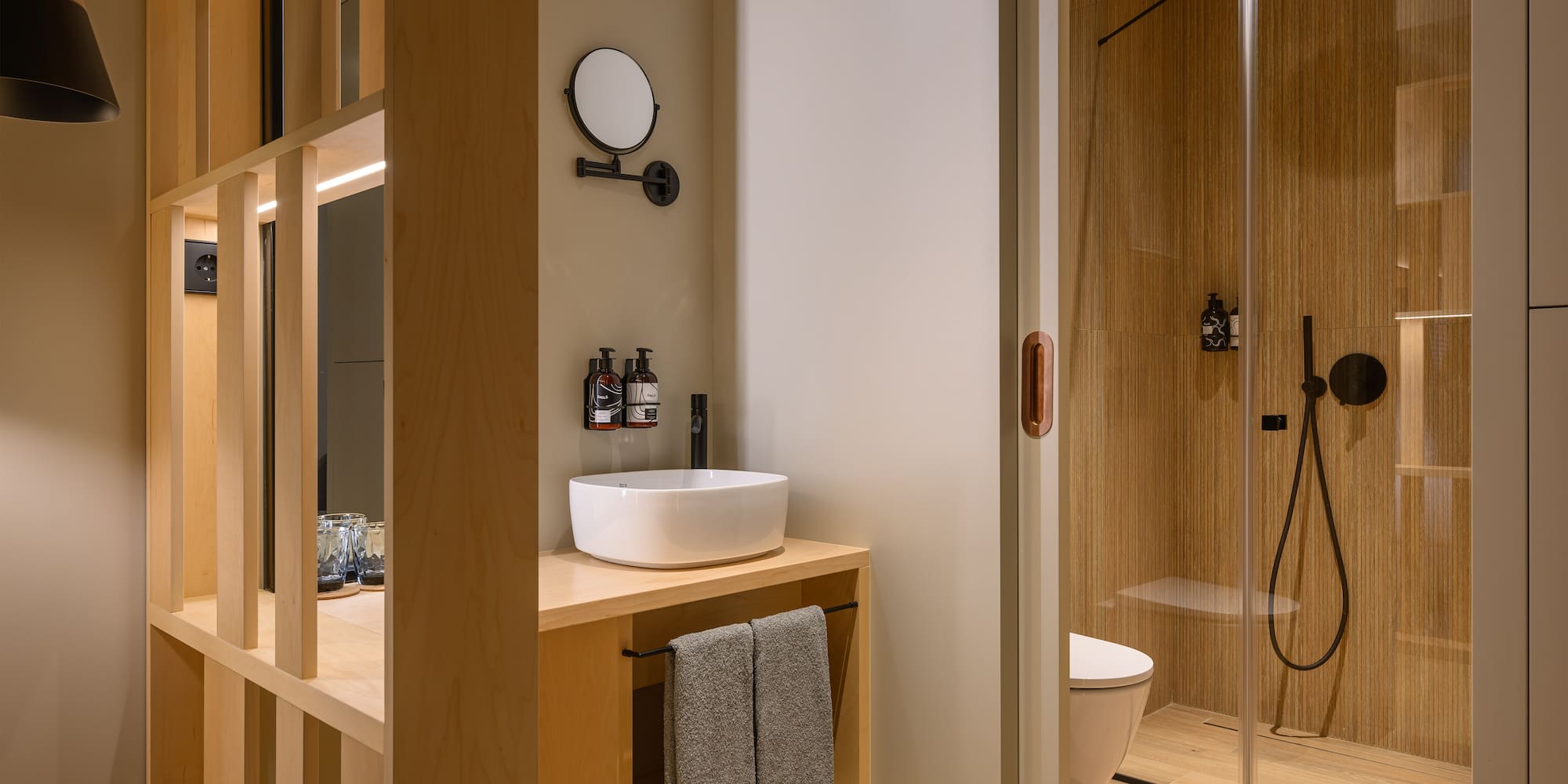 a bathroom with a shower and sink