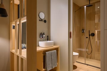 a bathroom with a shower and sink