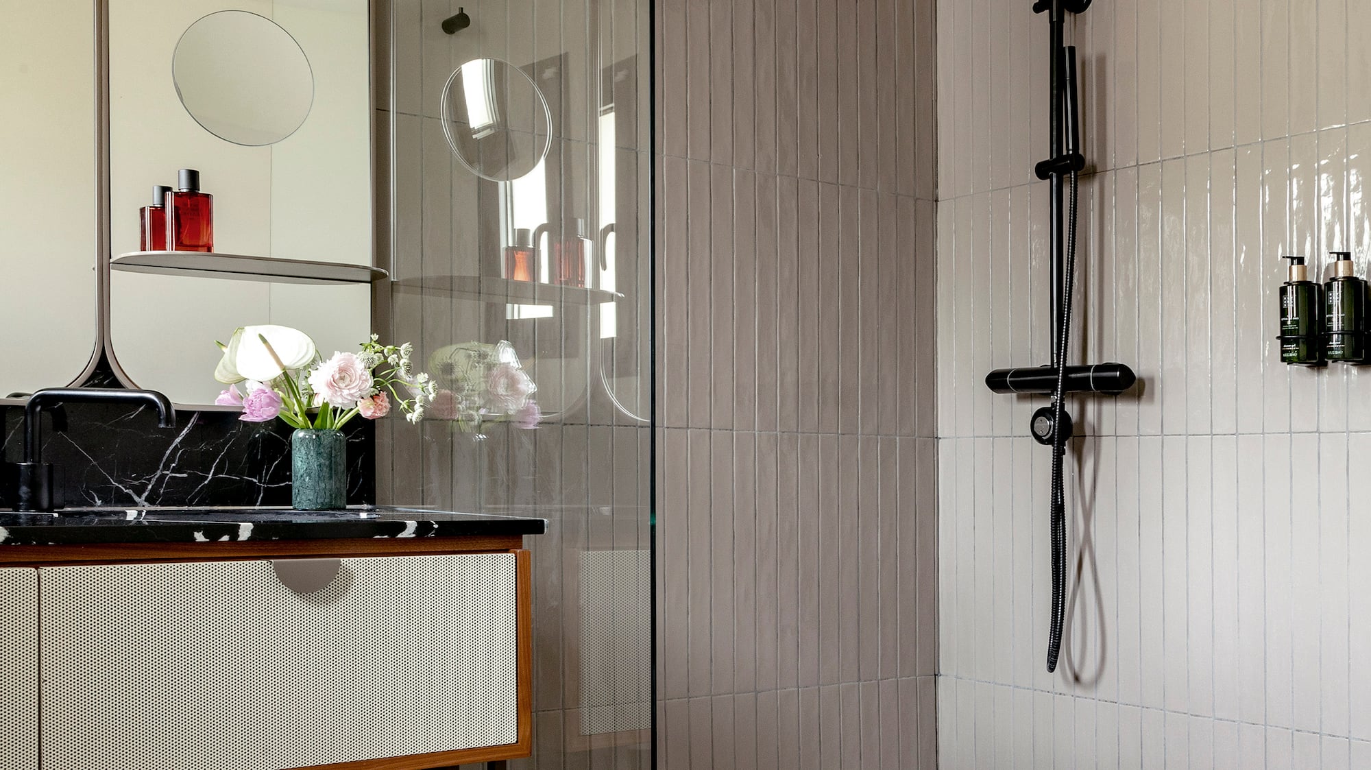a bathroom with a tub and shower