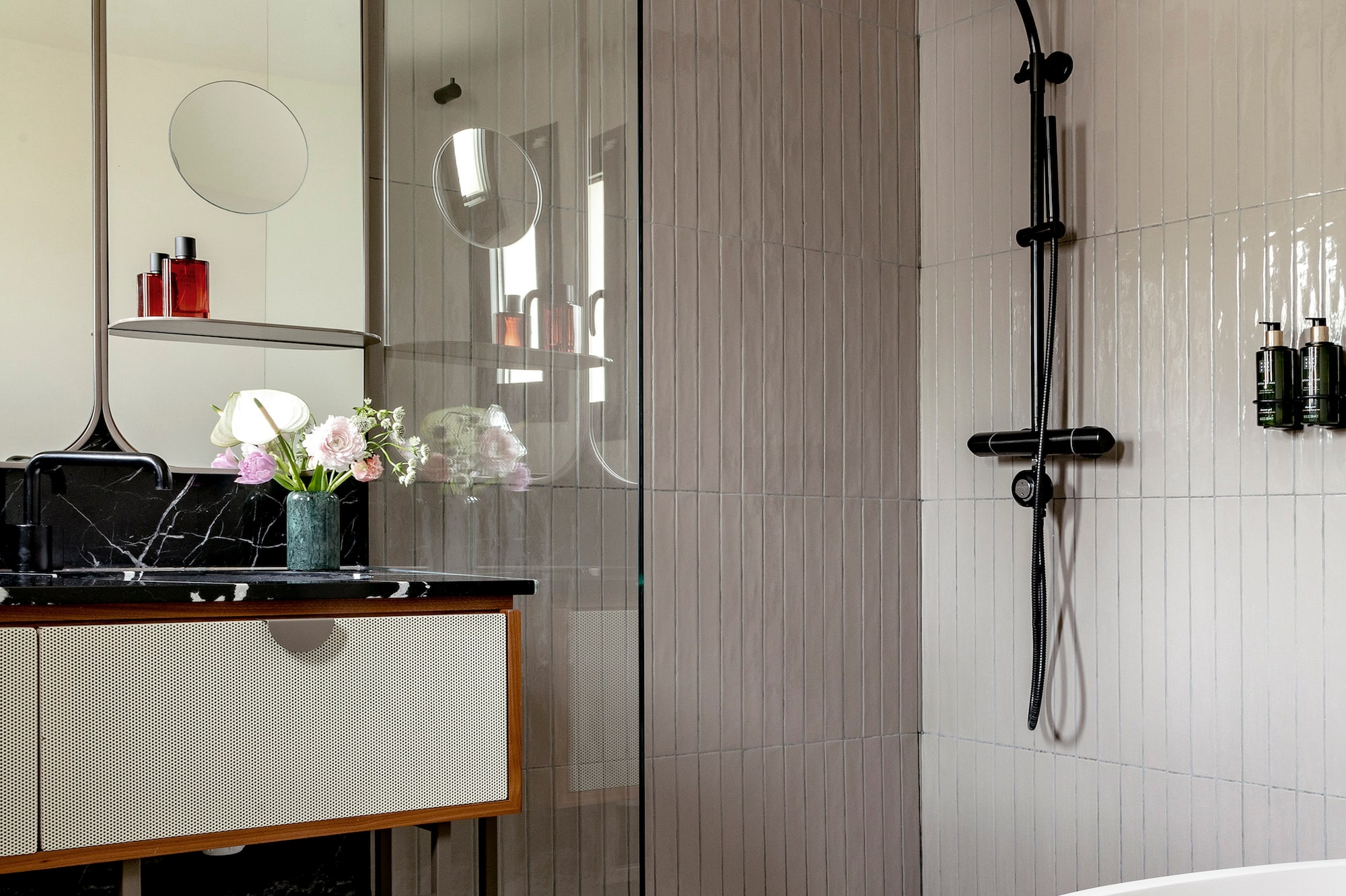 a bathroom with a tub and shower