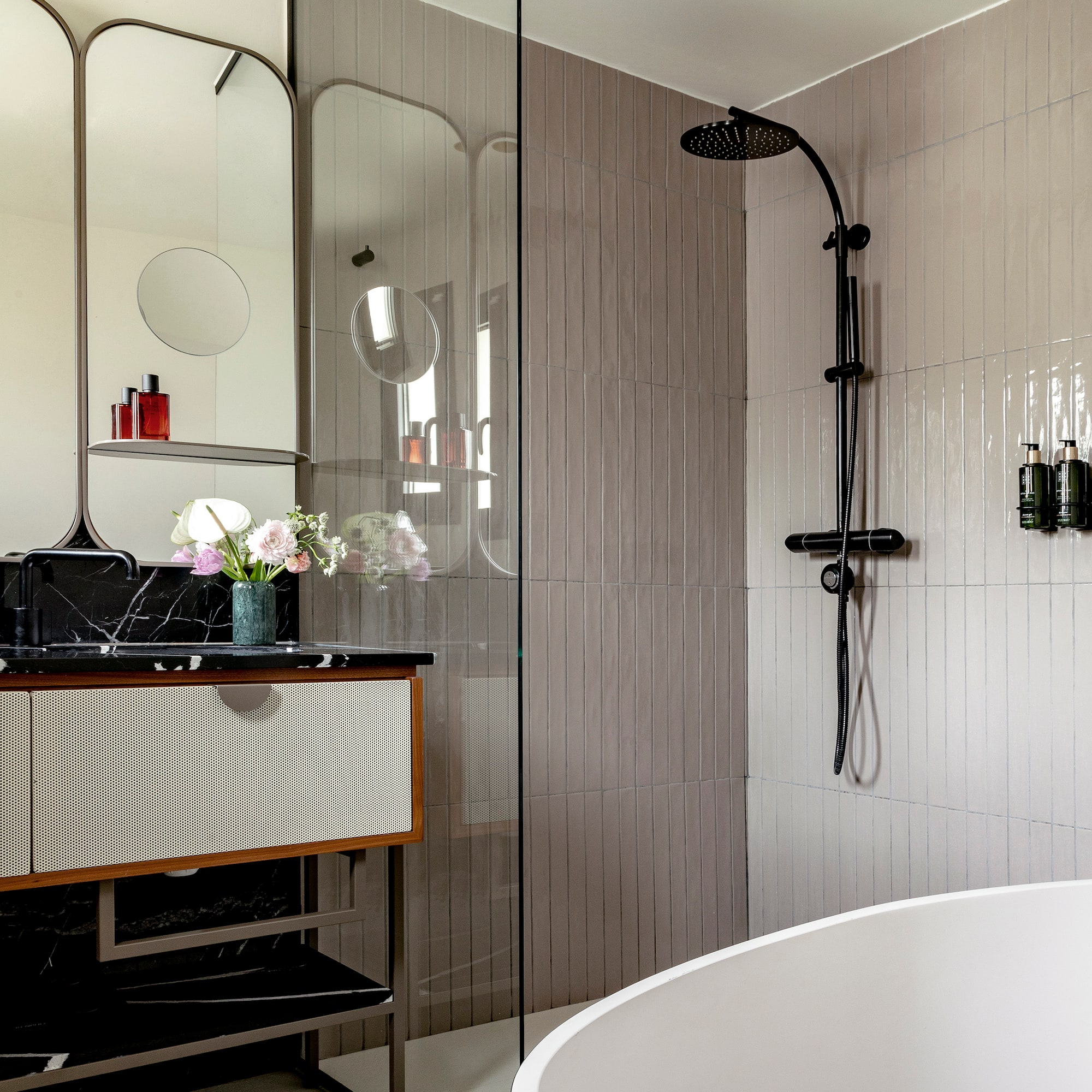 a bathroom with a tub and shower