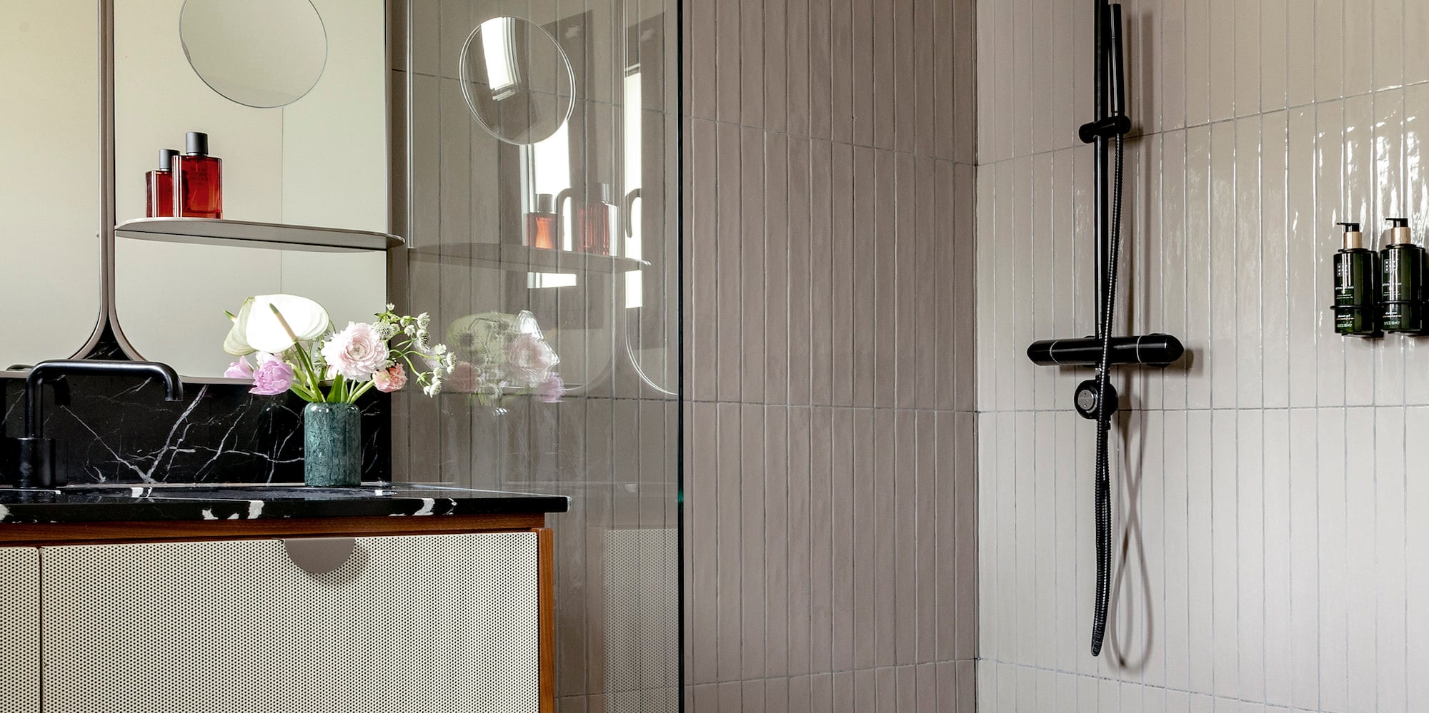 a bathroom with a tub and shower