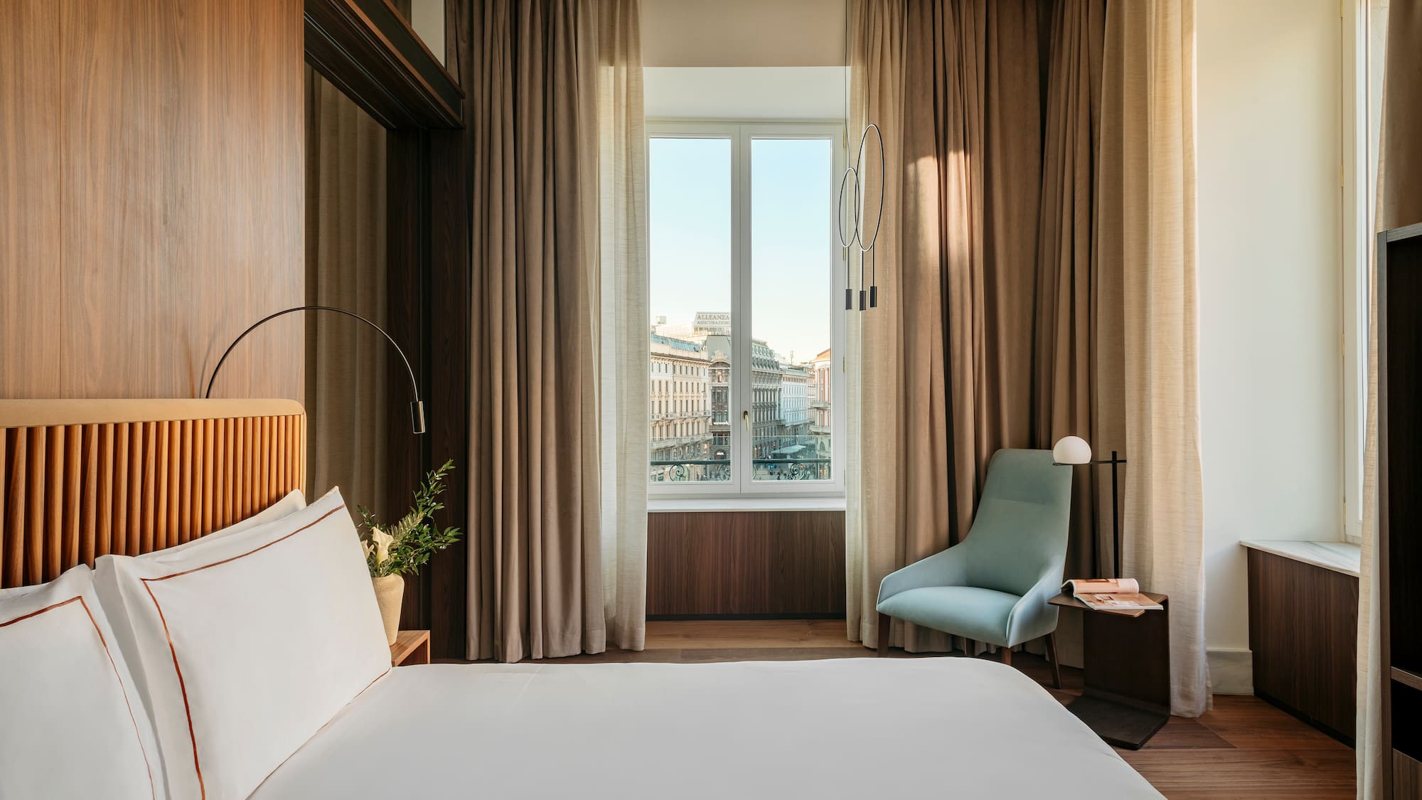 a bedroom with a bed and a chair