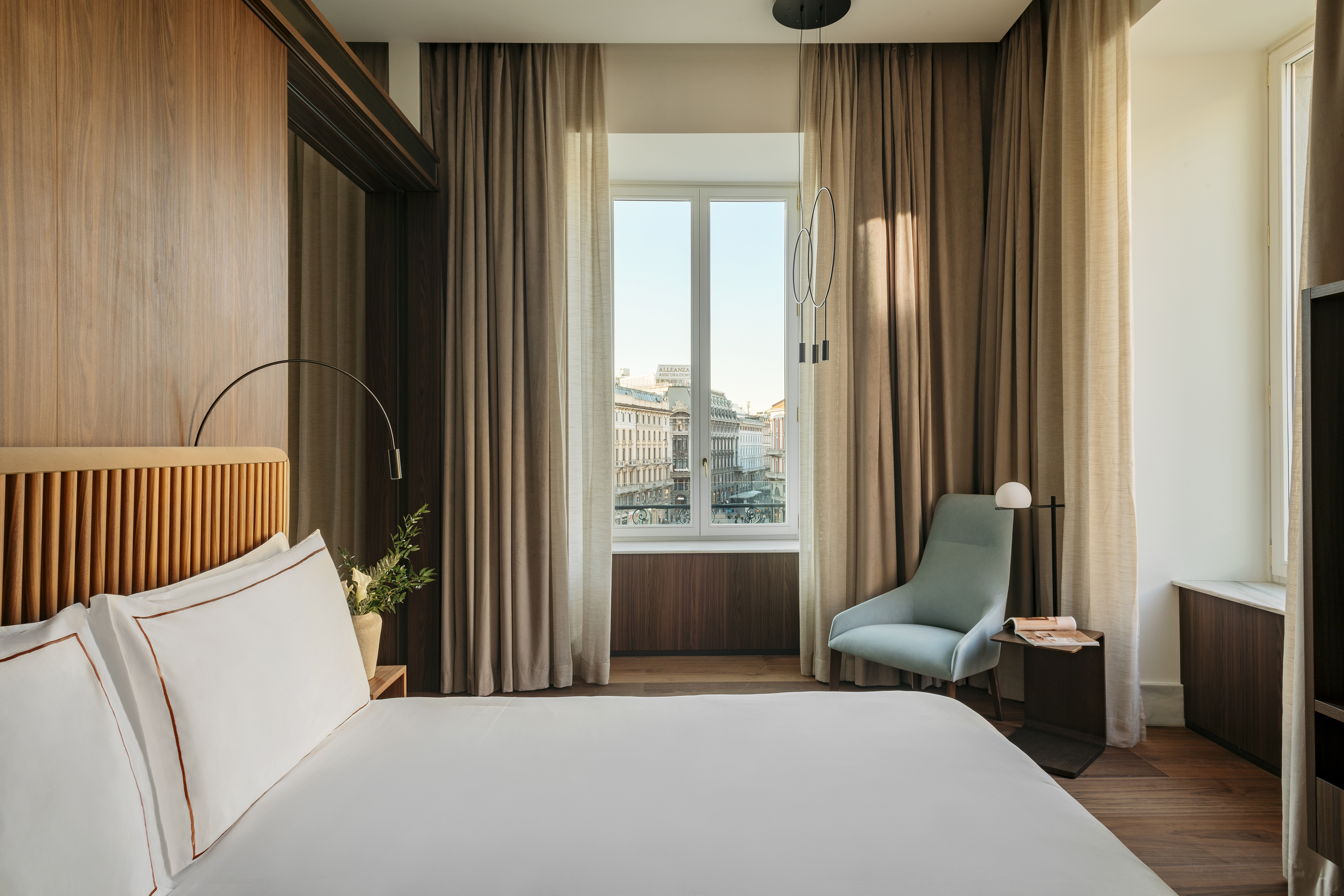 a bedroom with a bed and a chair