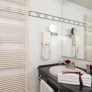 a bathroom with a sink and towel rack