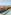 a pool on a rooftop overlooking a city