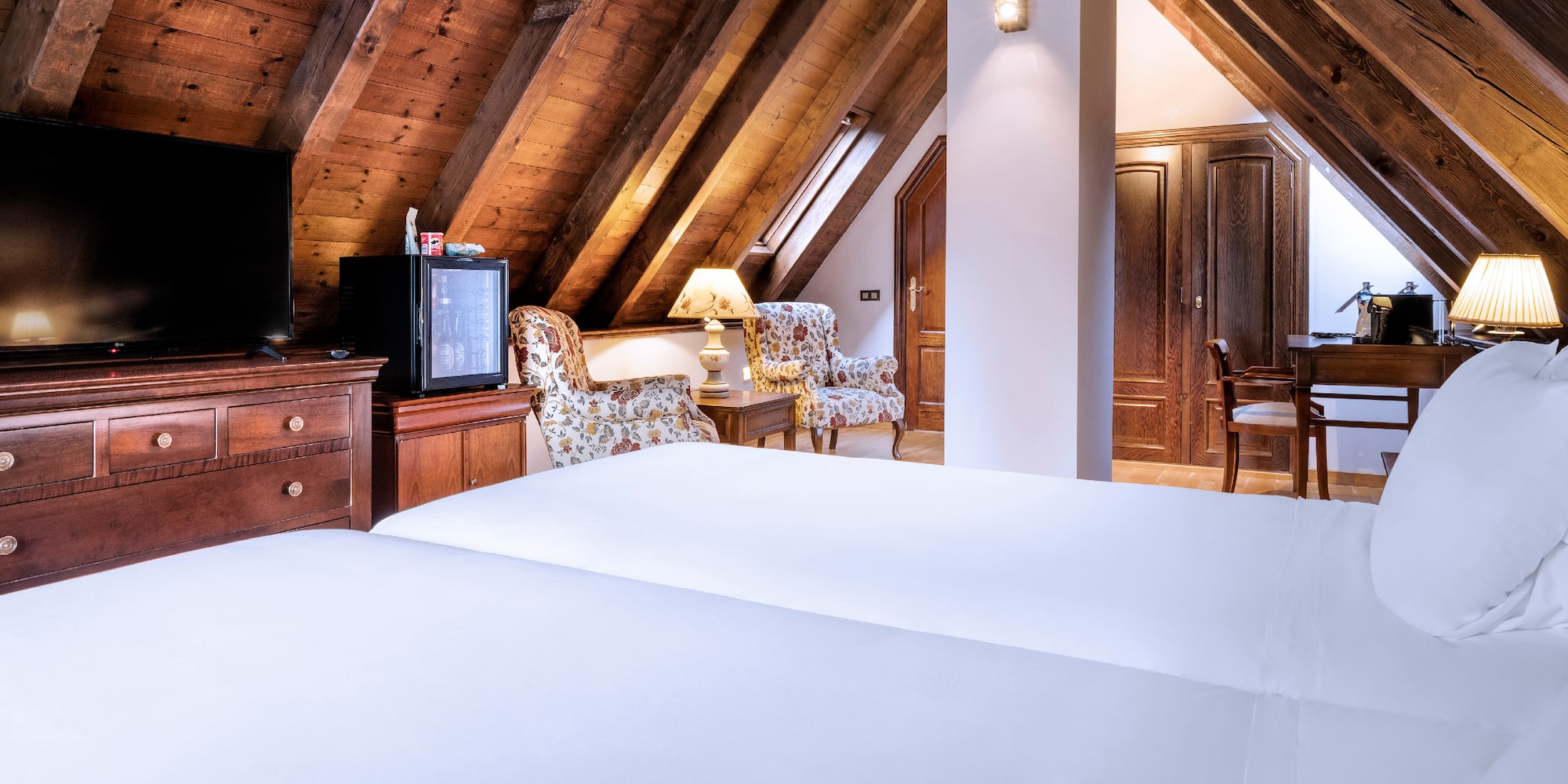 a room with a tv and a bed