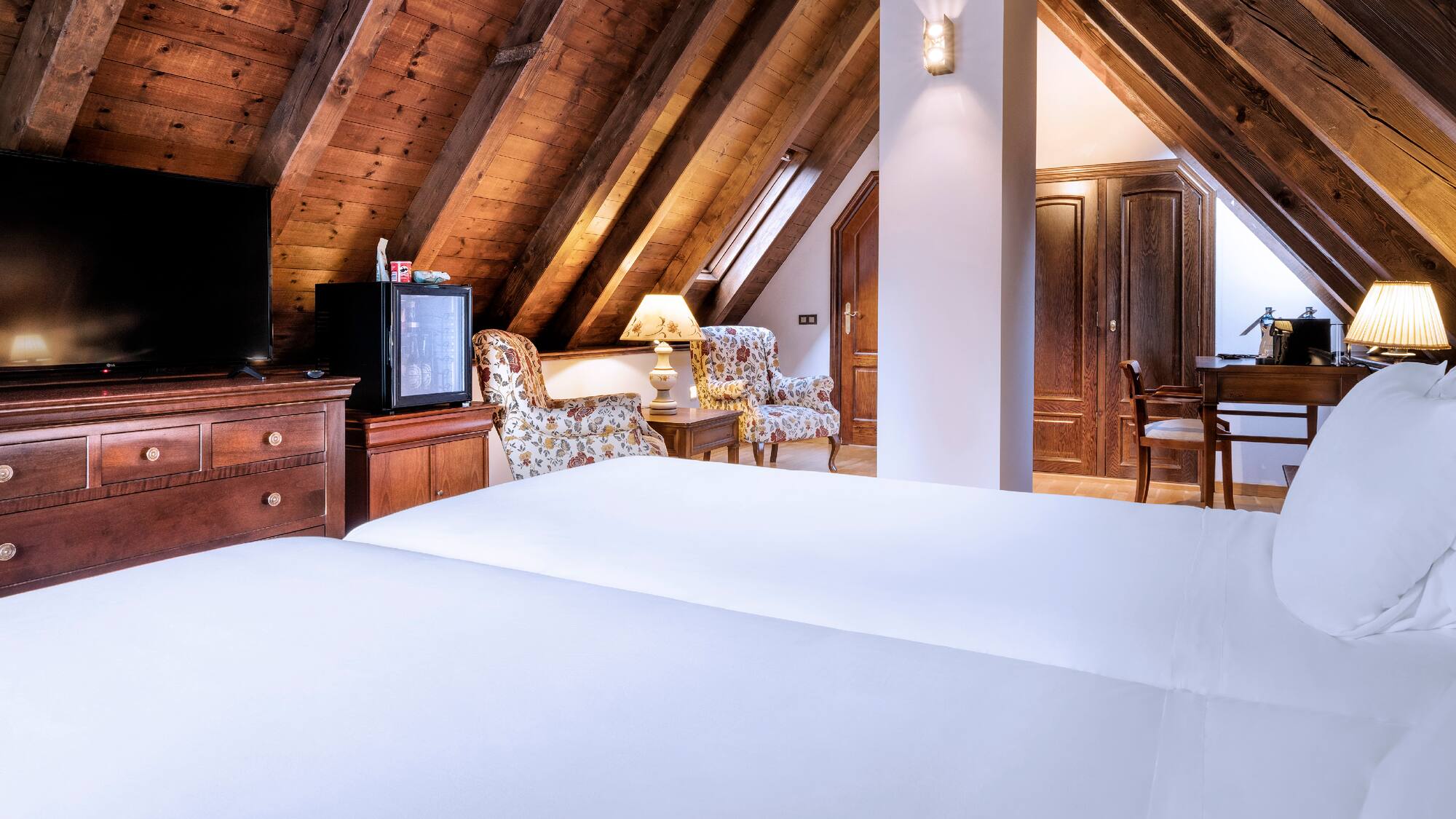 a room with a tv and a bed
