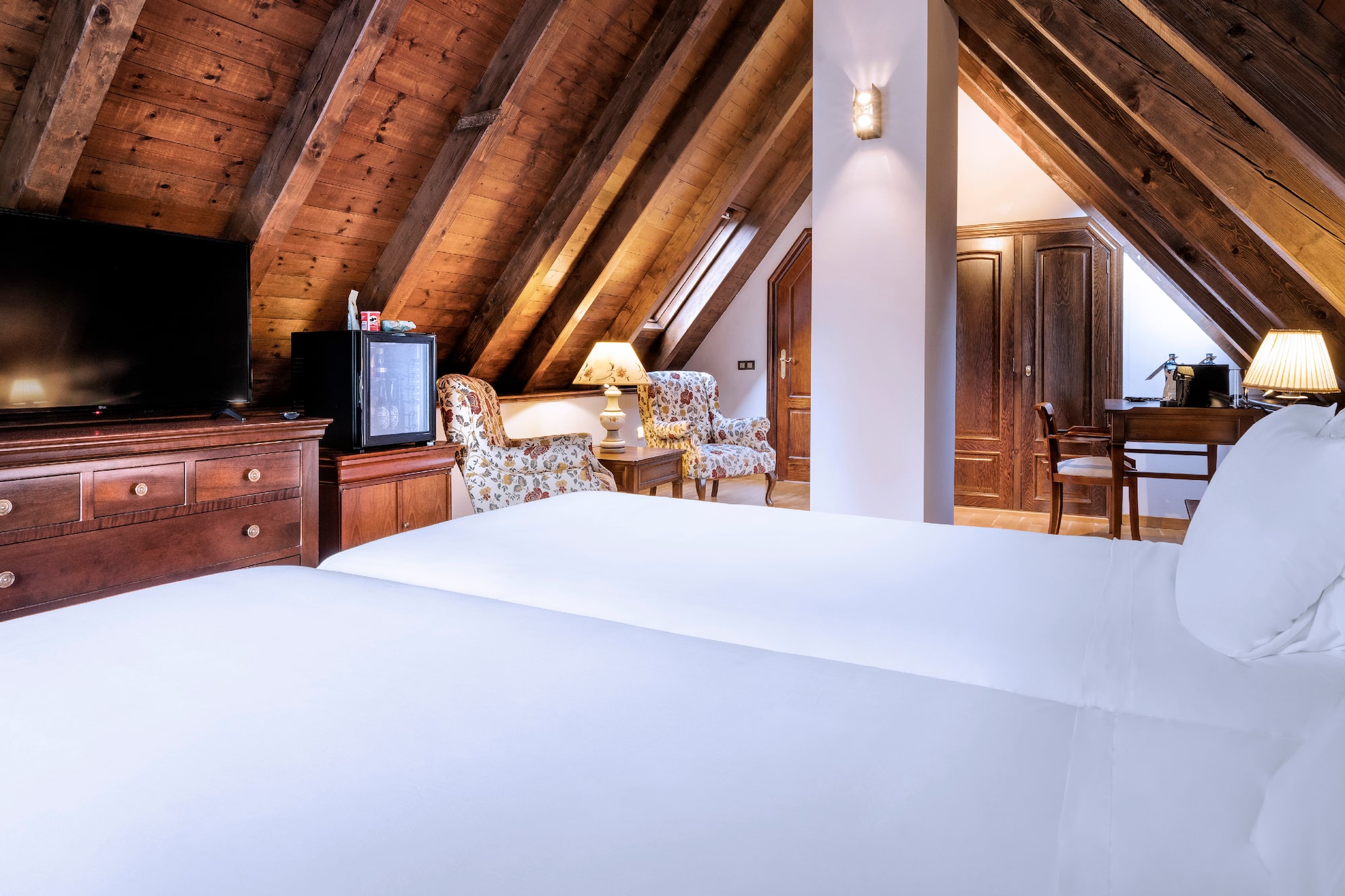 a room with a tv and a bed