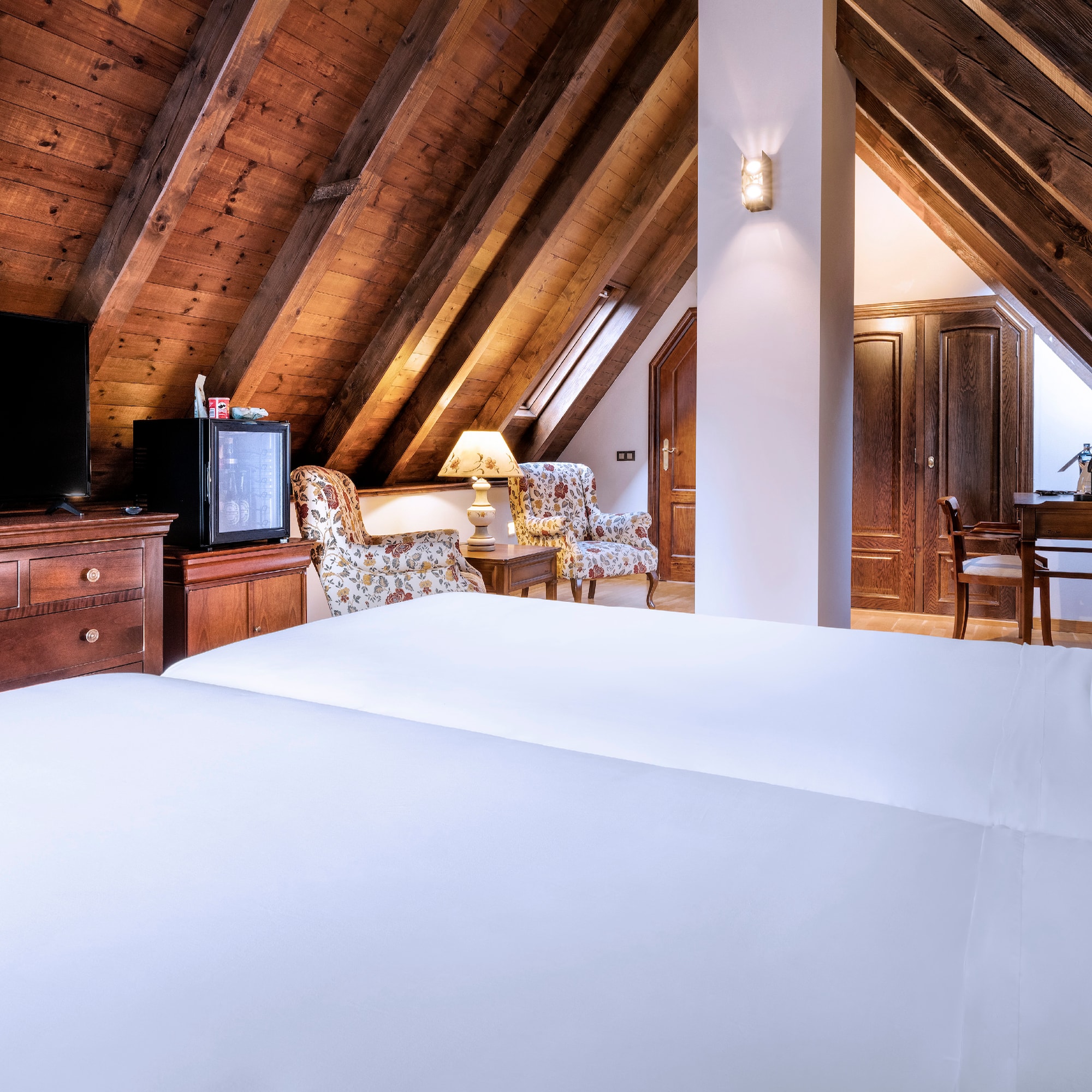 a room with a tv and a bed