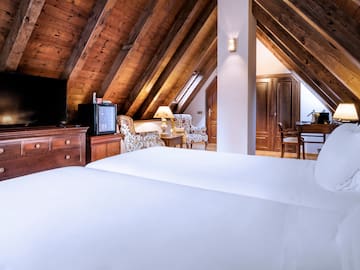 a room with a tv and a bed
