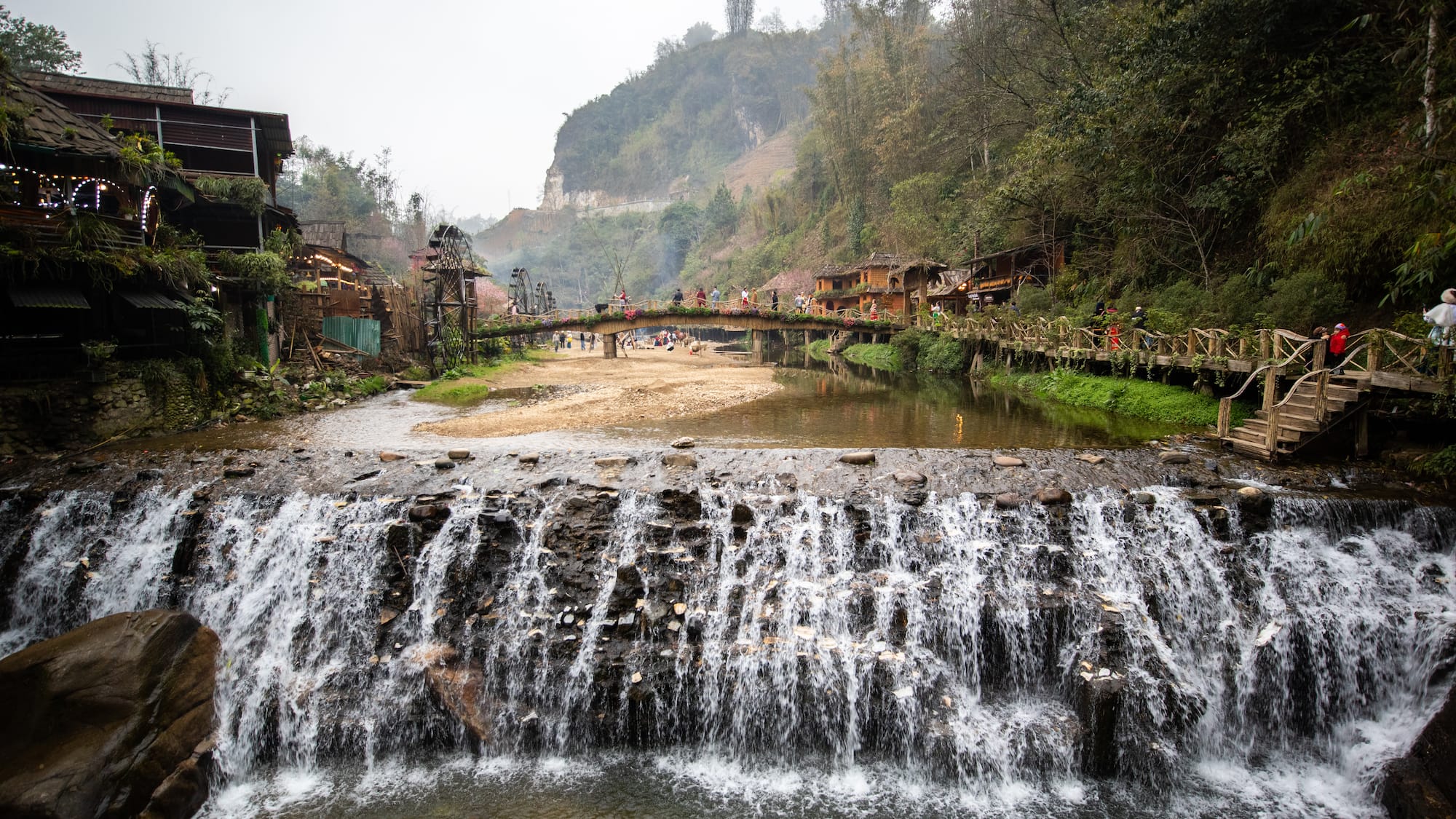 a waterfall over a river