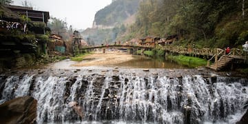 a waterfall over a river