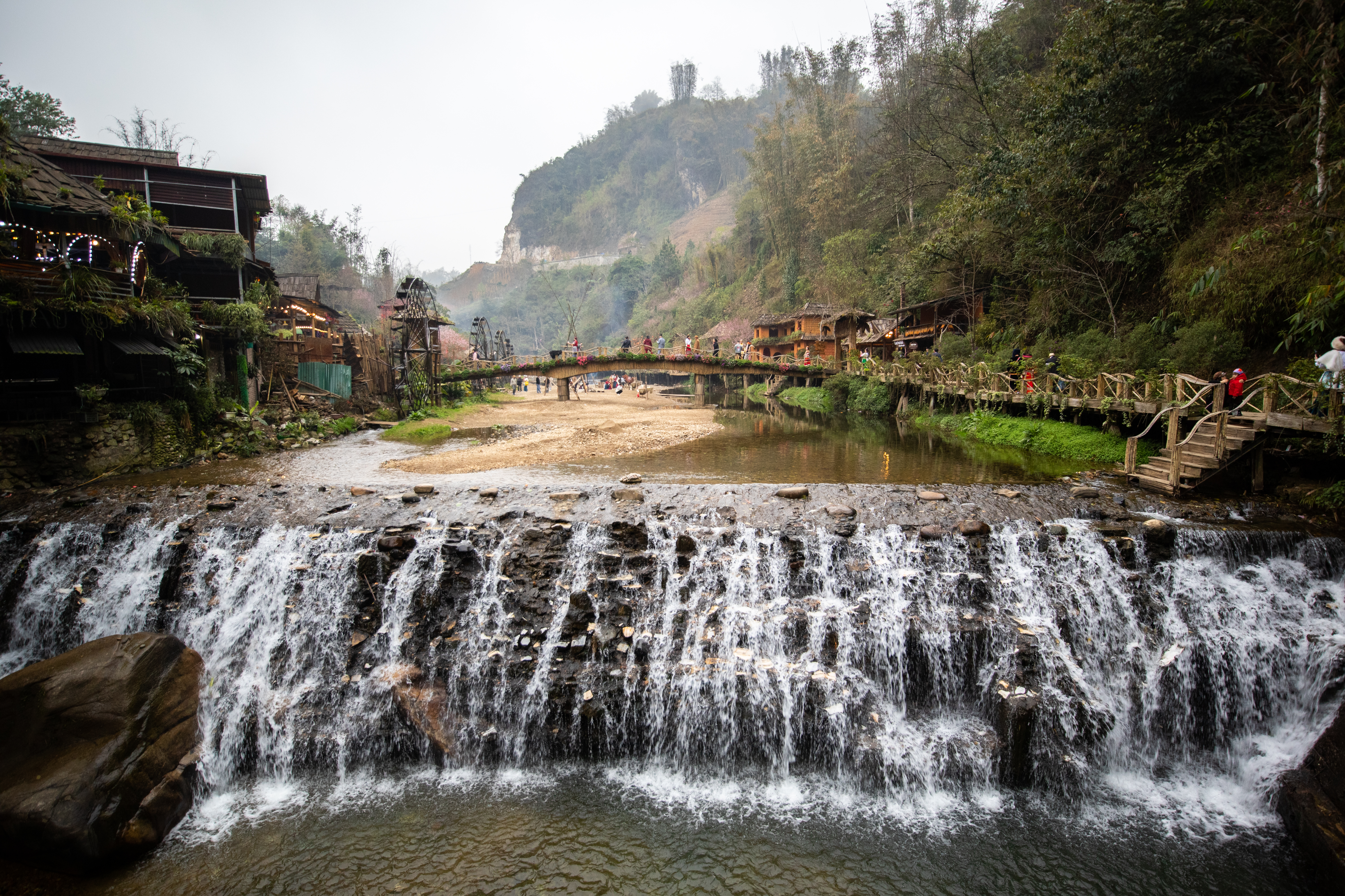 a waterfall over a river
