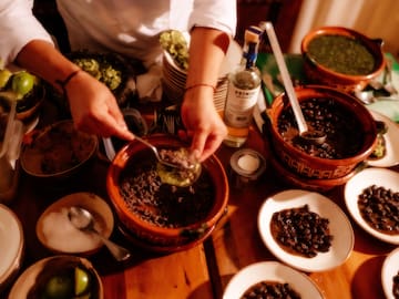 a person mixing food in bowls