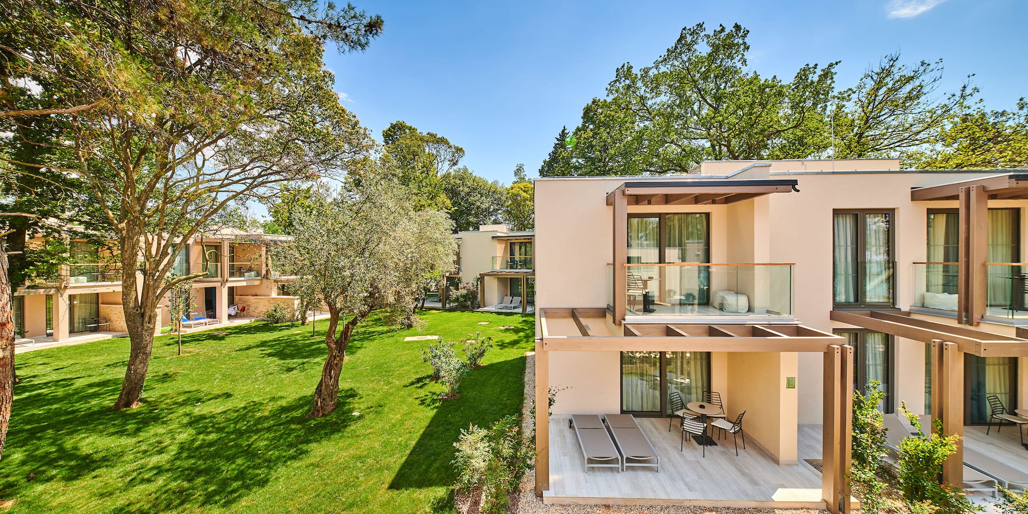 a building with a deck and a lawn