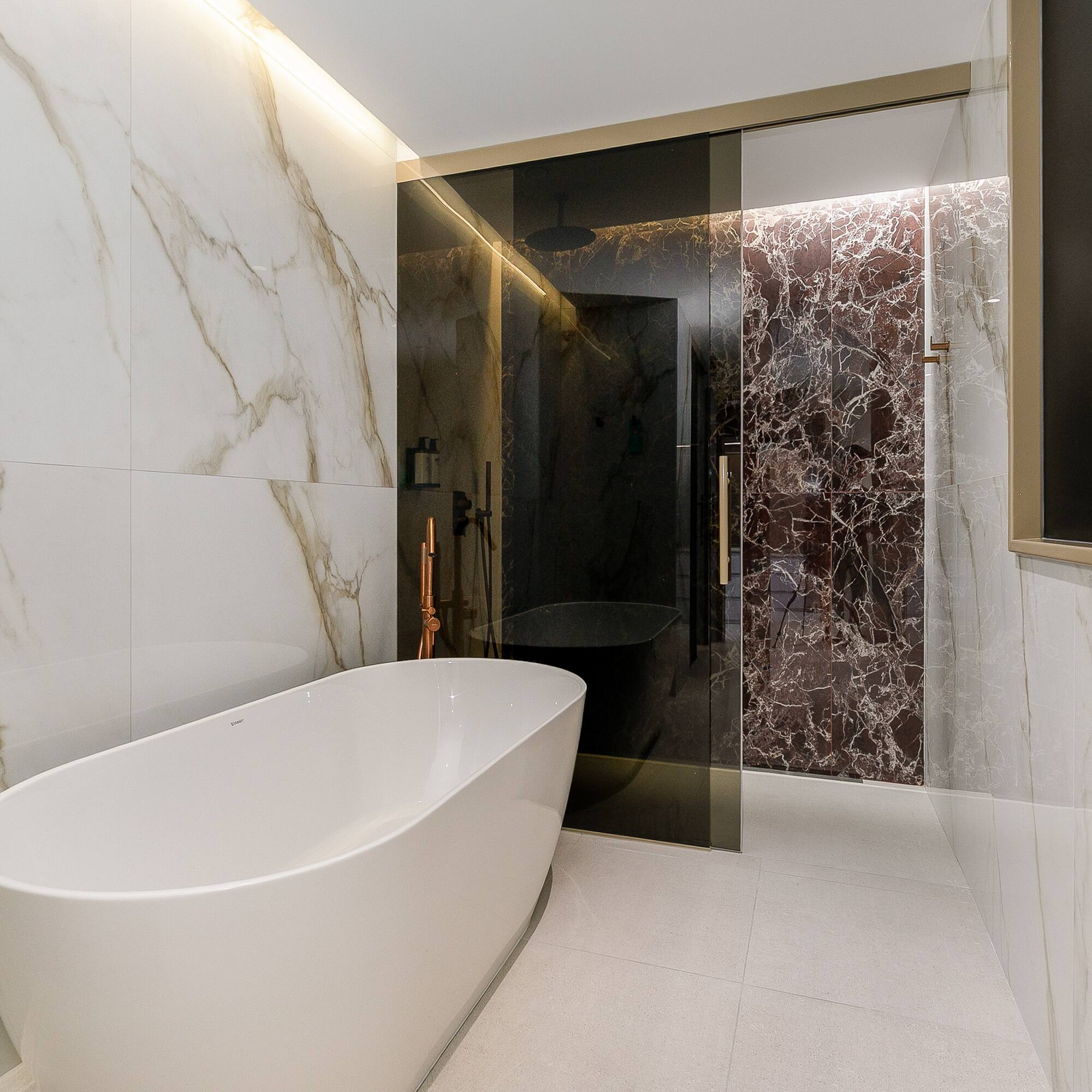 a bathroom with a tub and shower