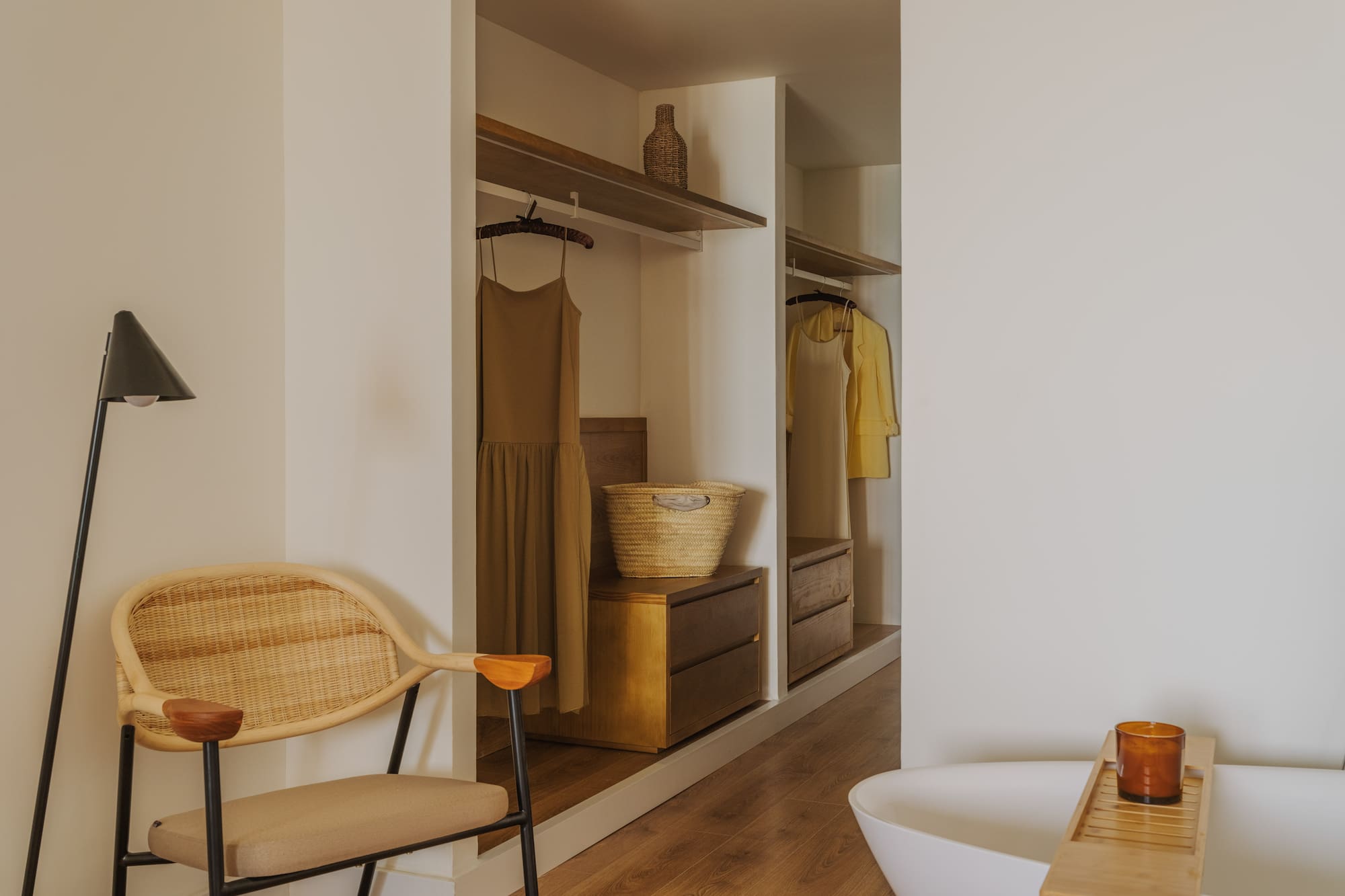 a room with a tub and a chair