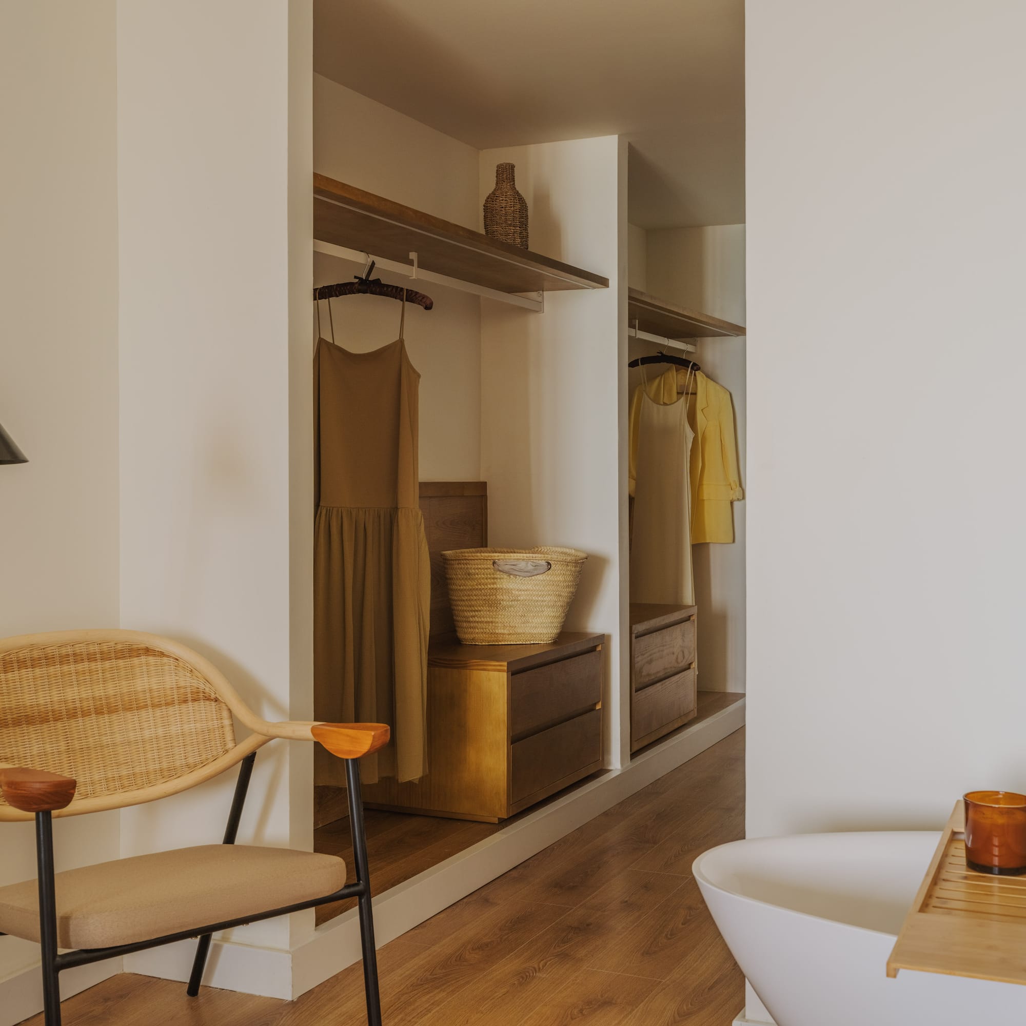 a room with a tub and a chair