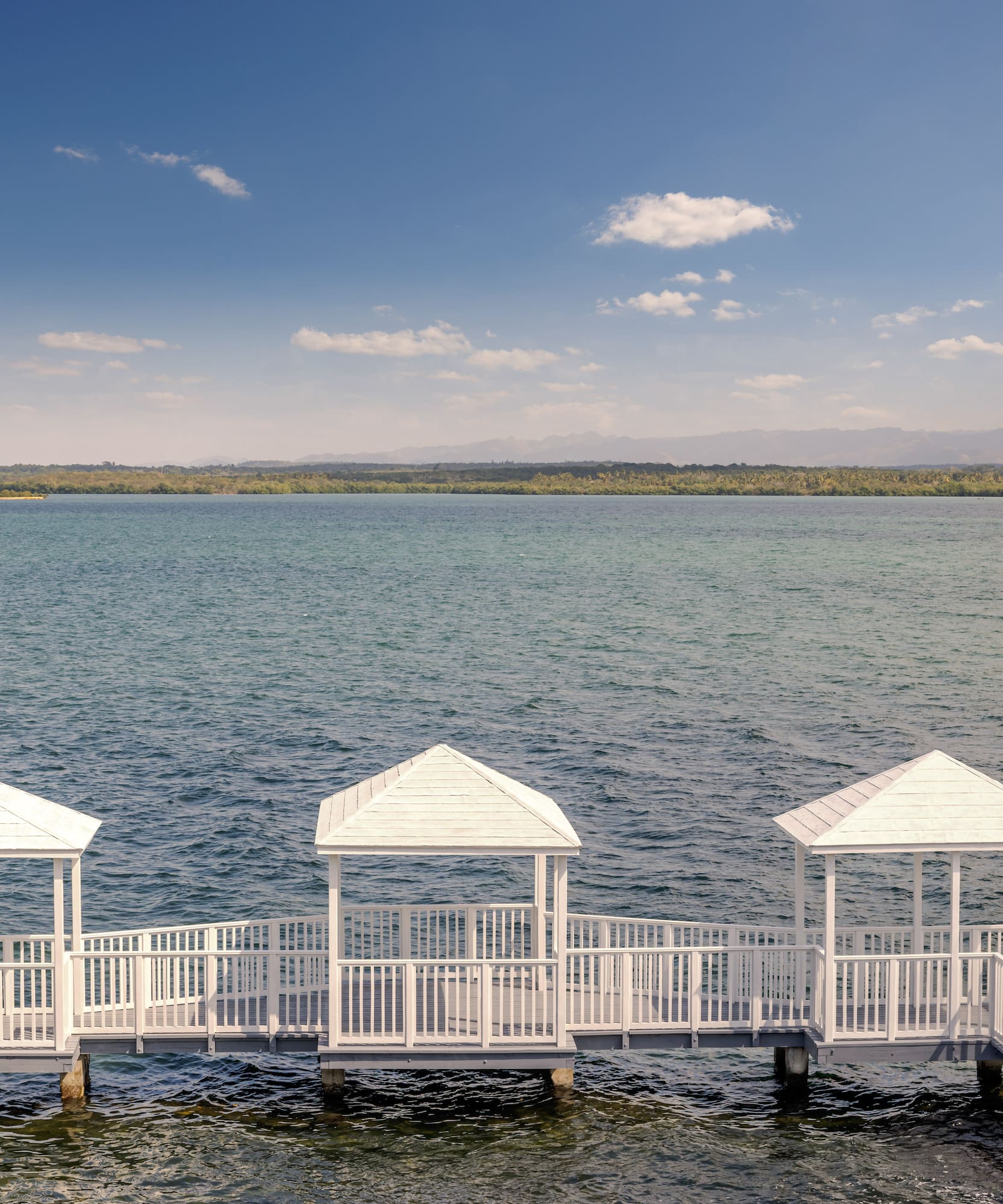 a white walkway over water