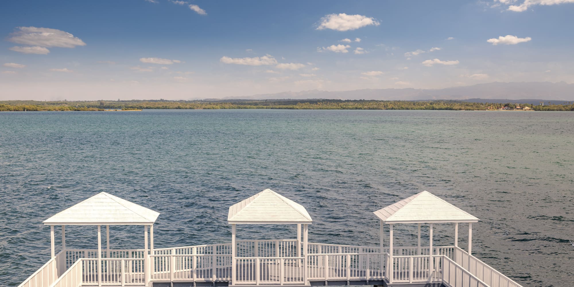 a white walkway over water