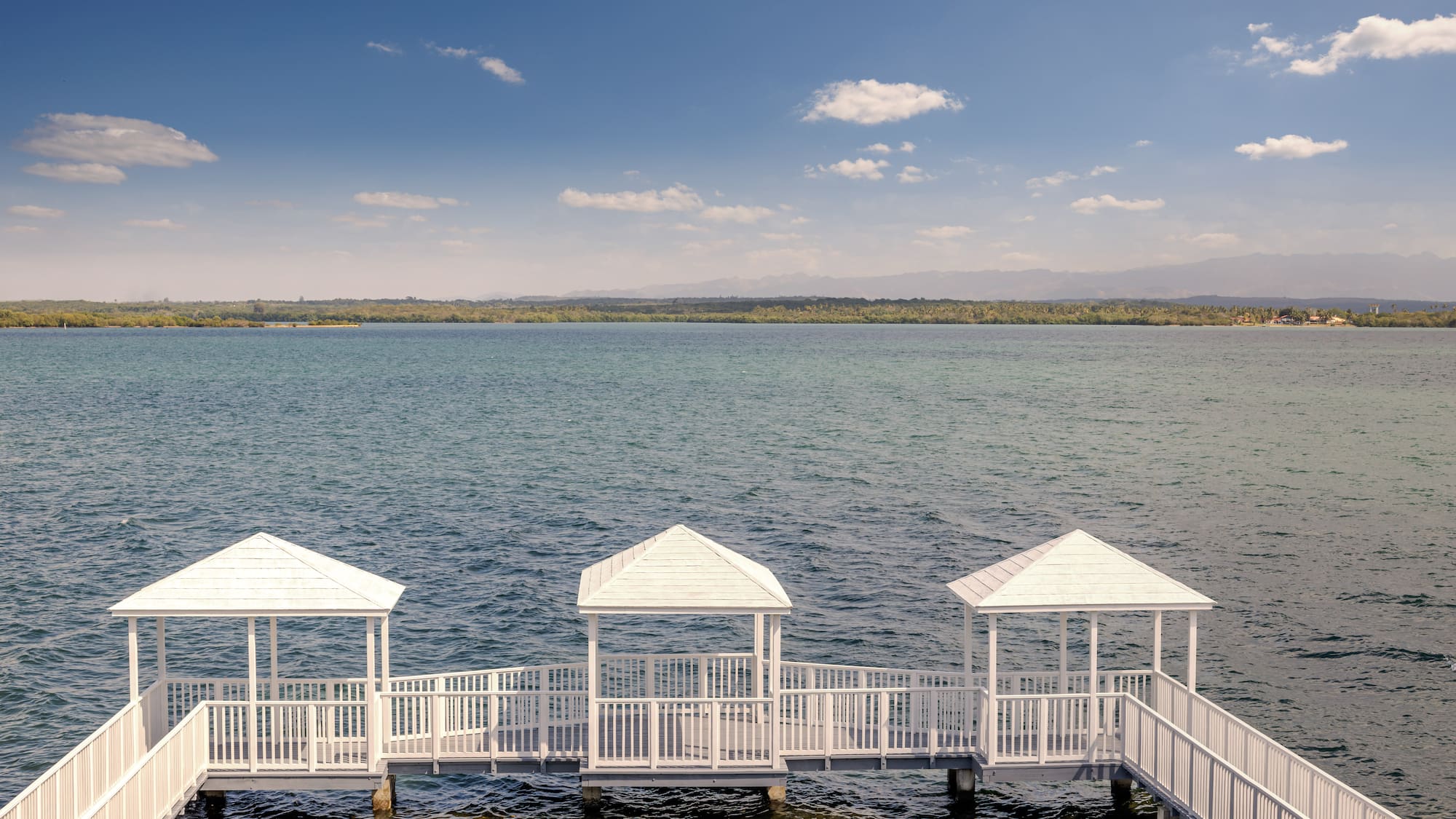 a white walkway over water