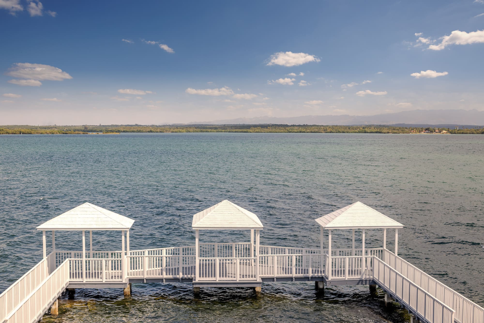 a white walkway over water