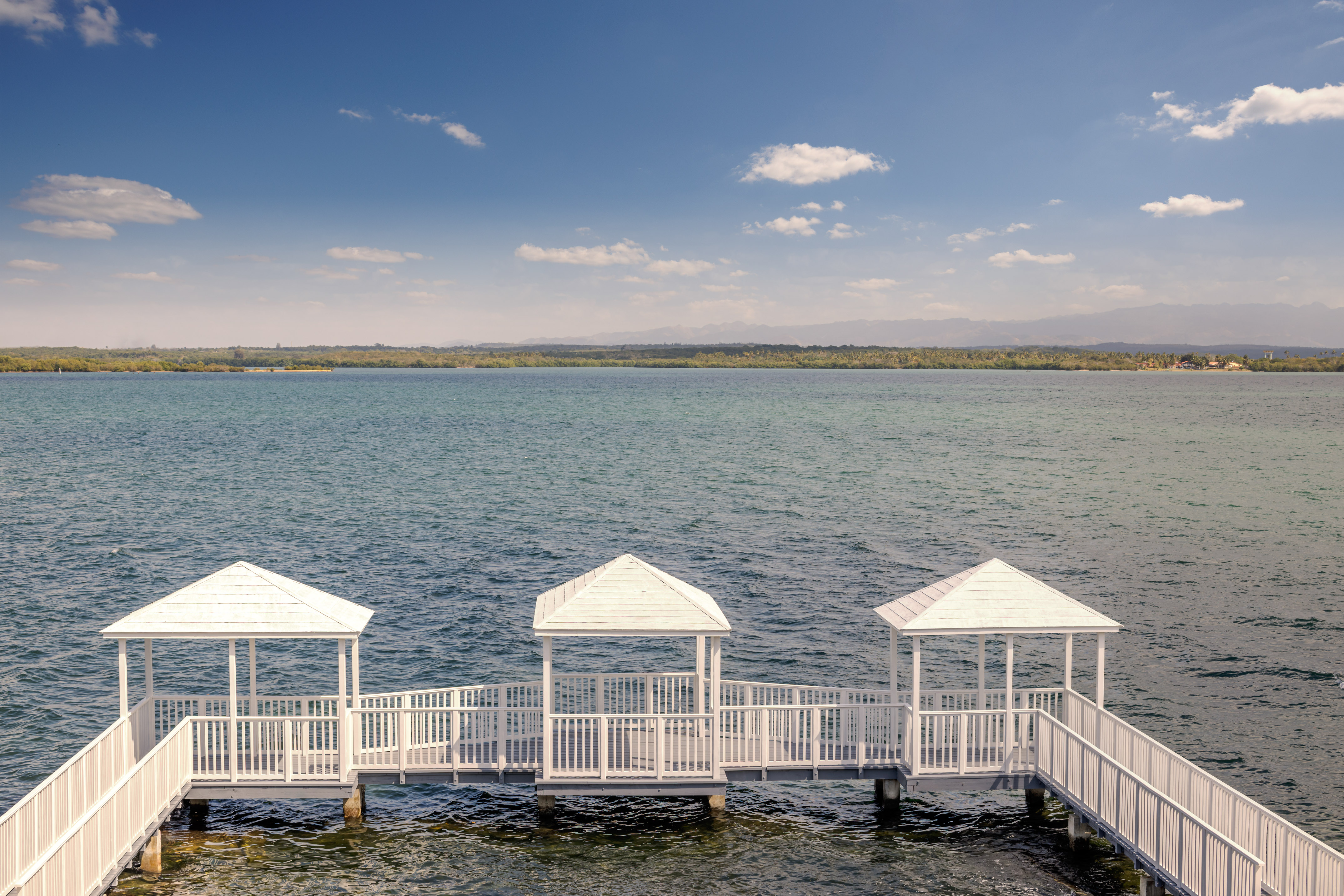 a white walkway over water
