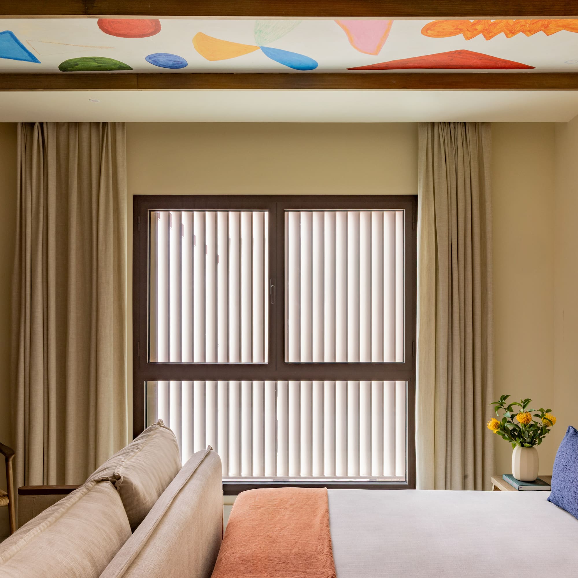 a room with a bed and a window